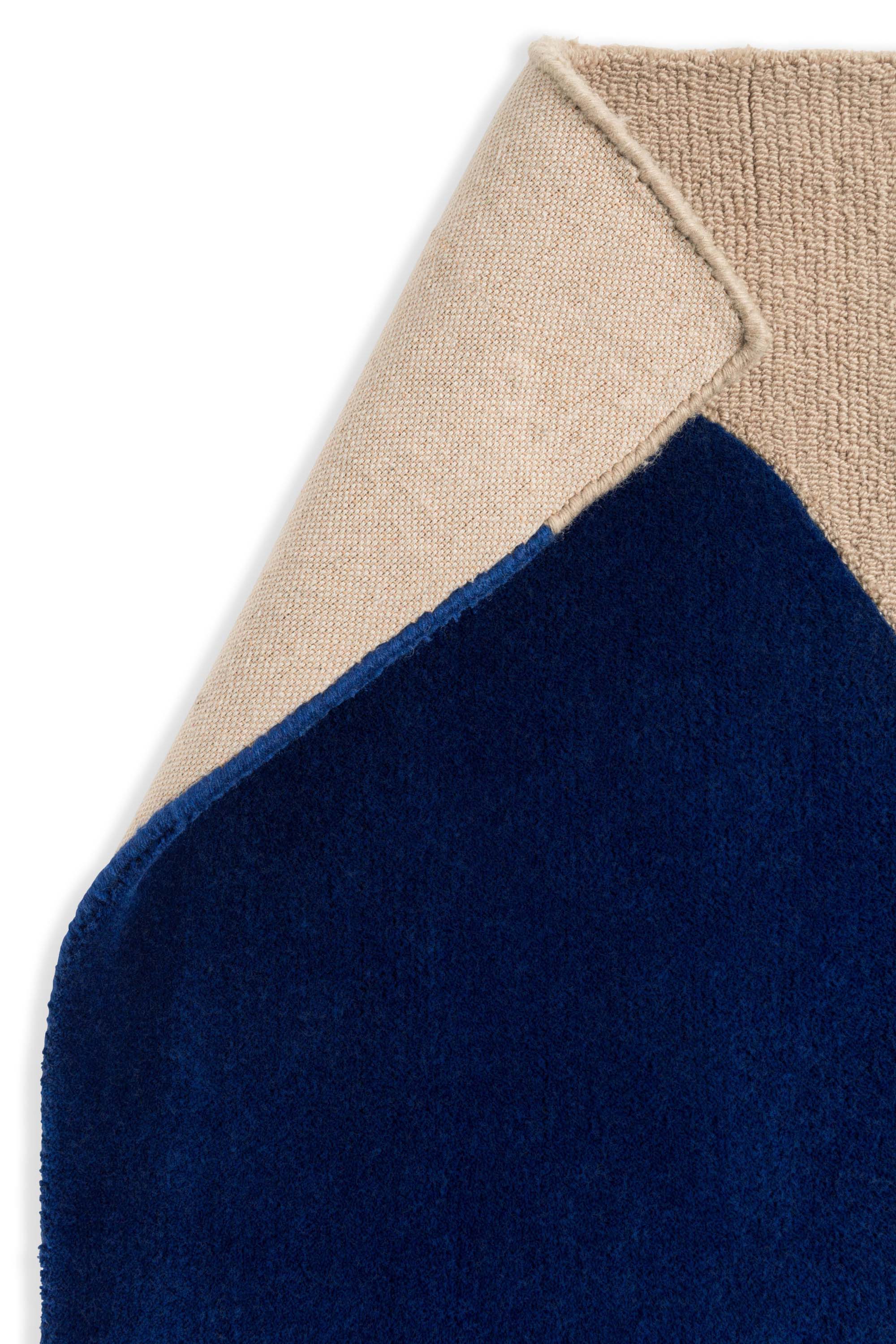 Beige rug with blue repeated circle pattern