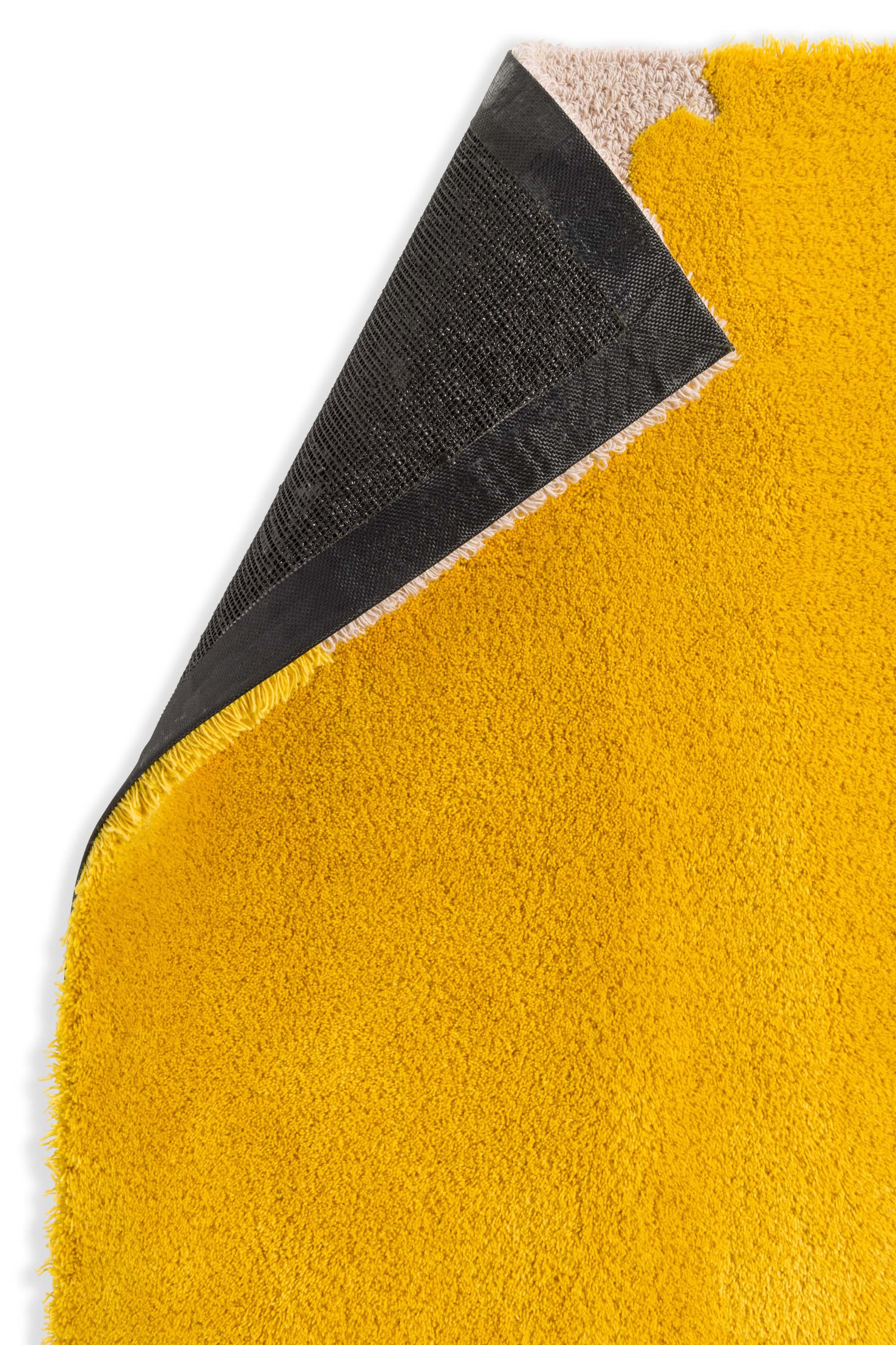 Plain rug with yellow floral pattern