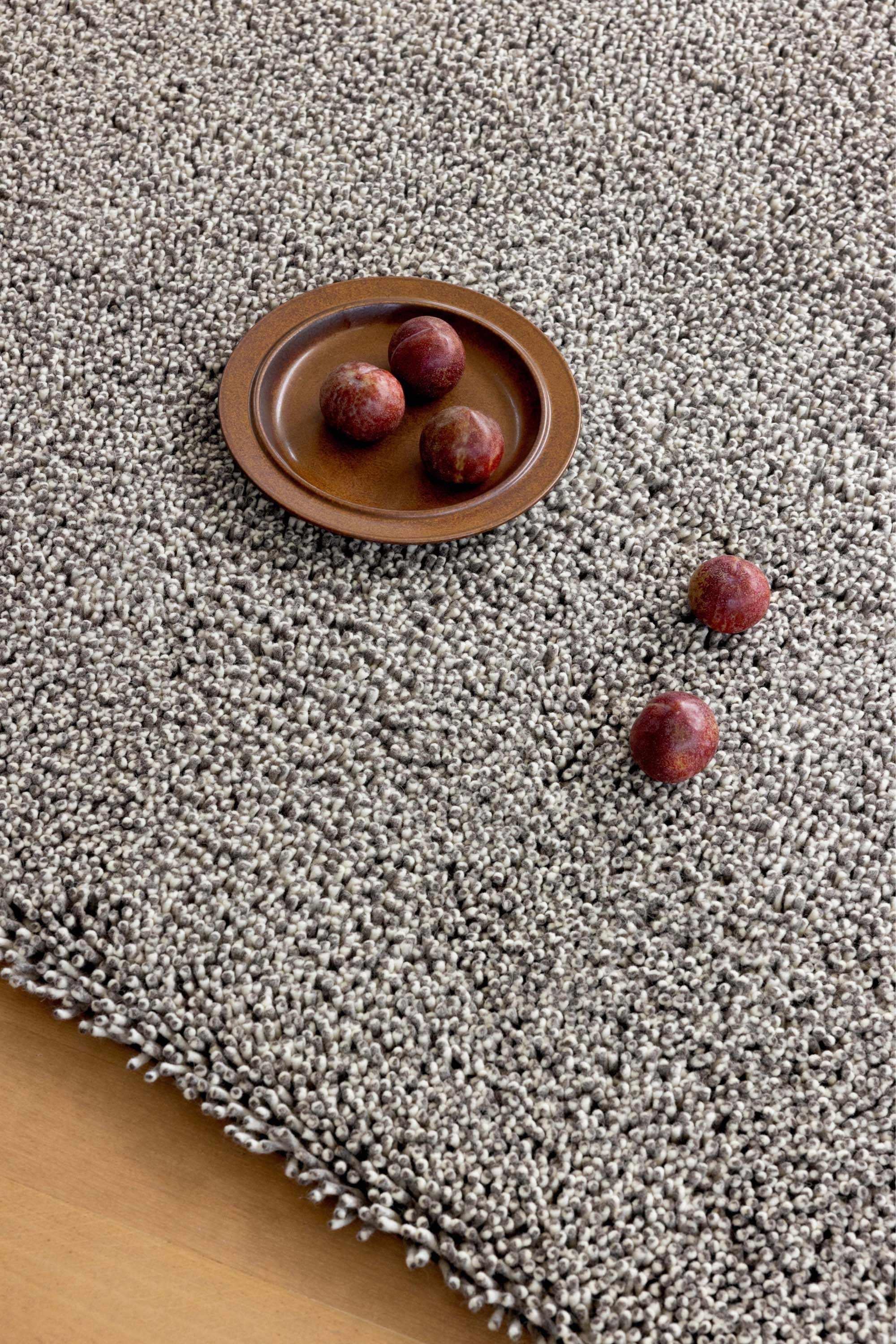 Plain dark grey rug with shaggy pile