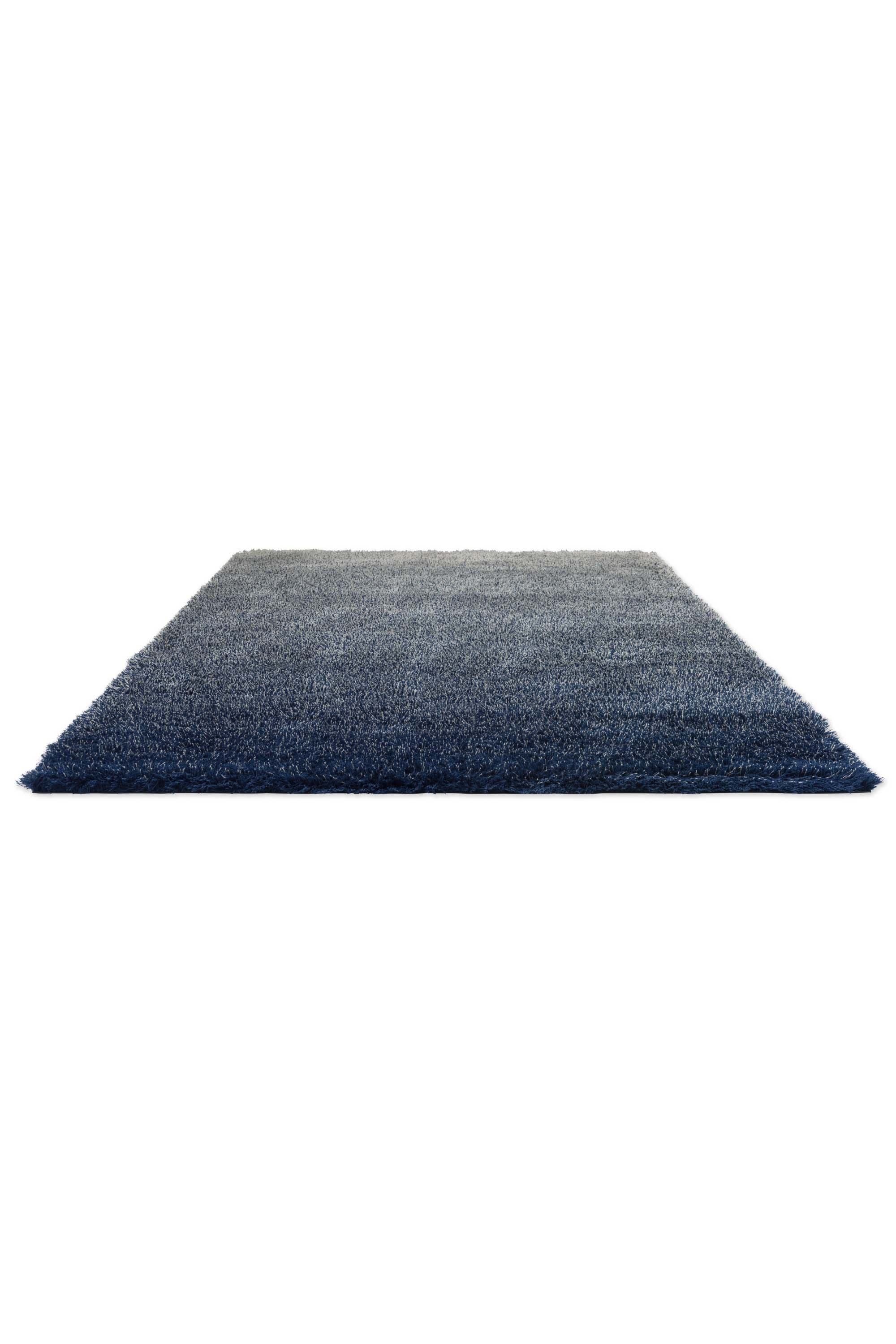 Plain blue rug with shaggy pile