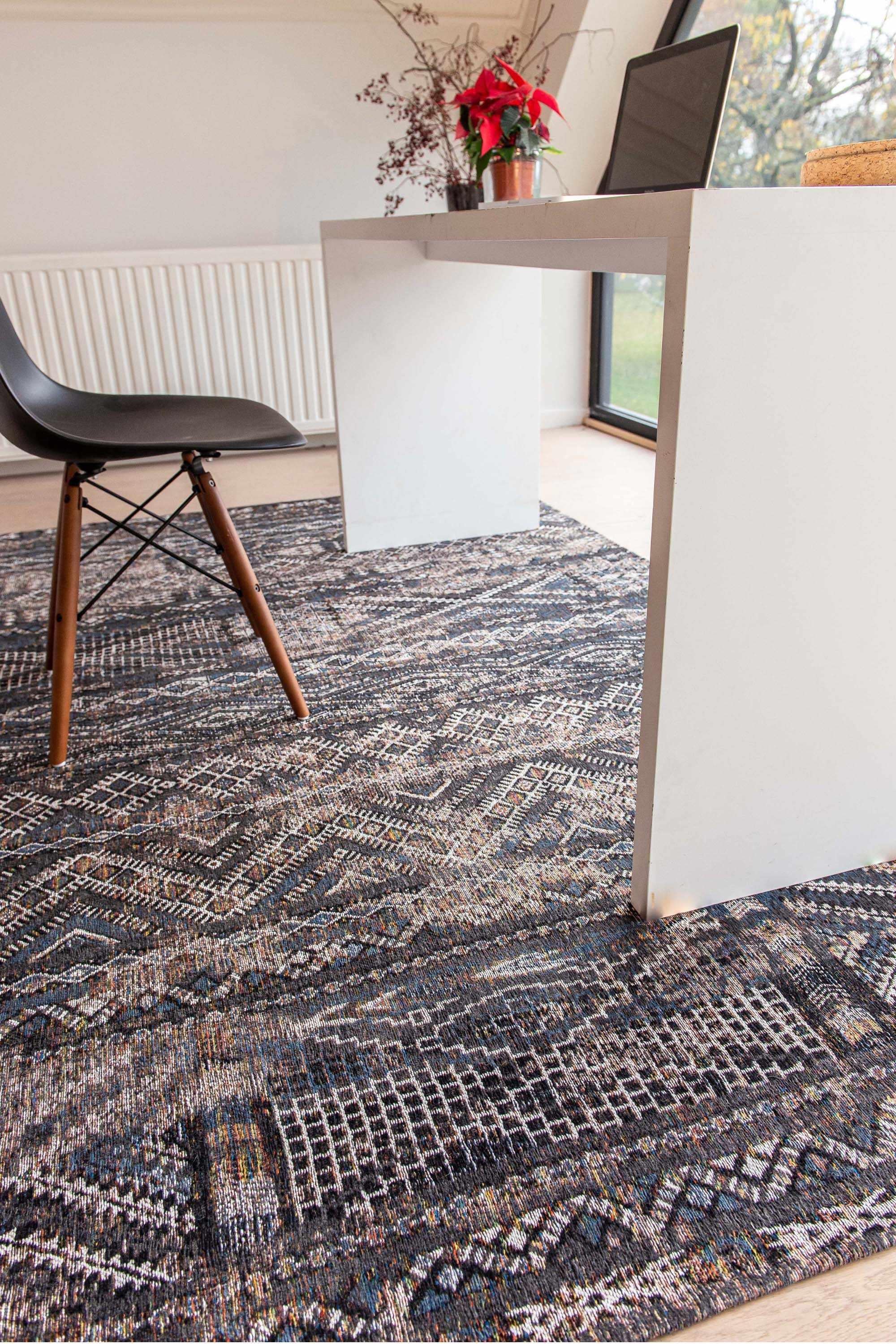 brown rug with a moroccan geometric pattern