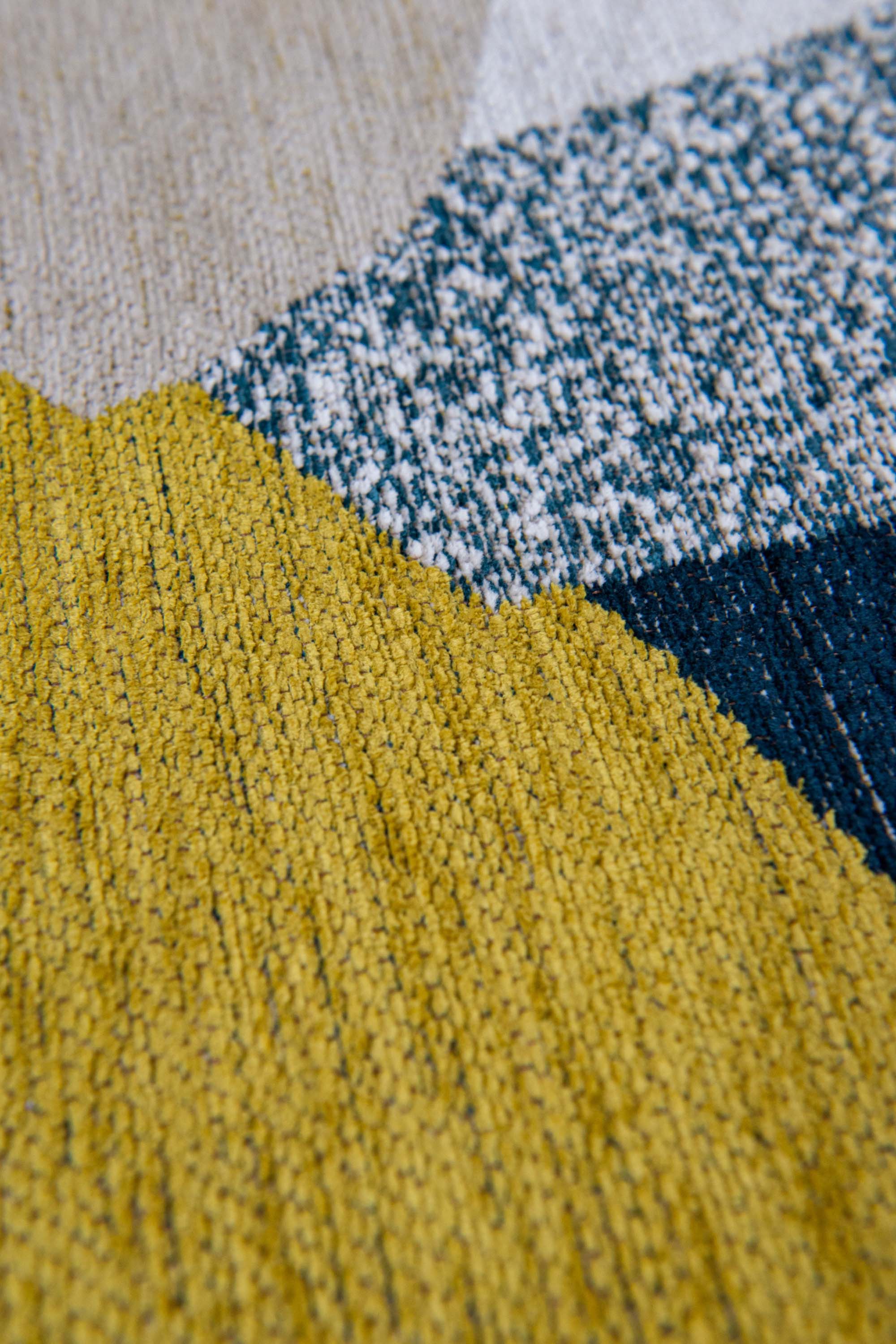 Modern rug with blue and yellow abstract pattern