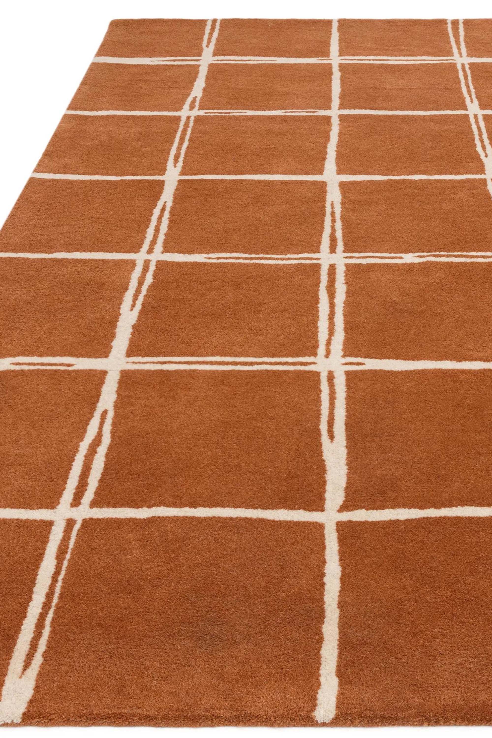 Orange rug with minimal geometric pattern