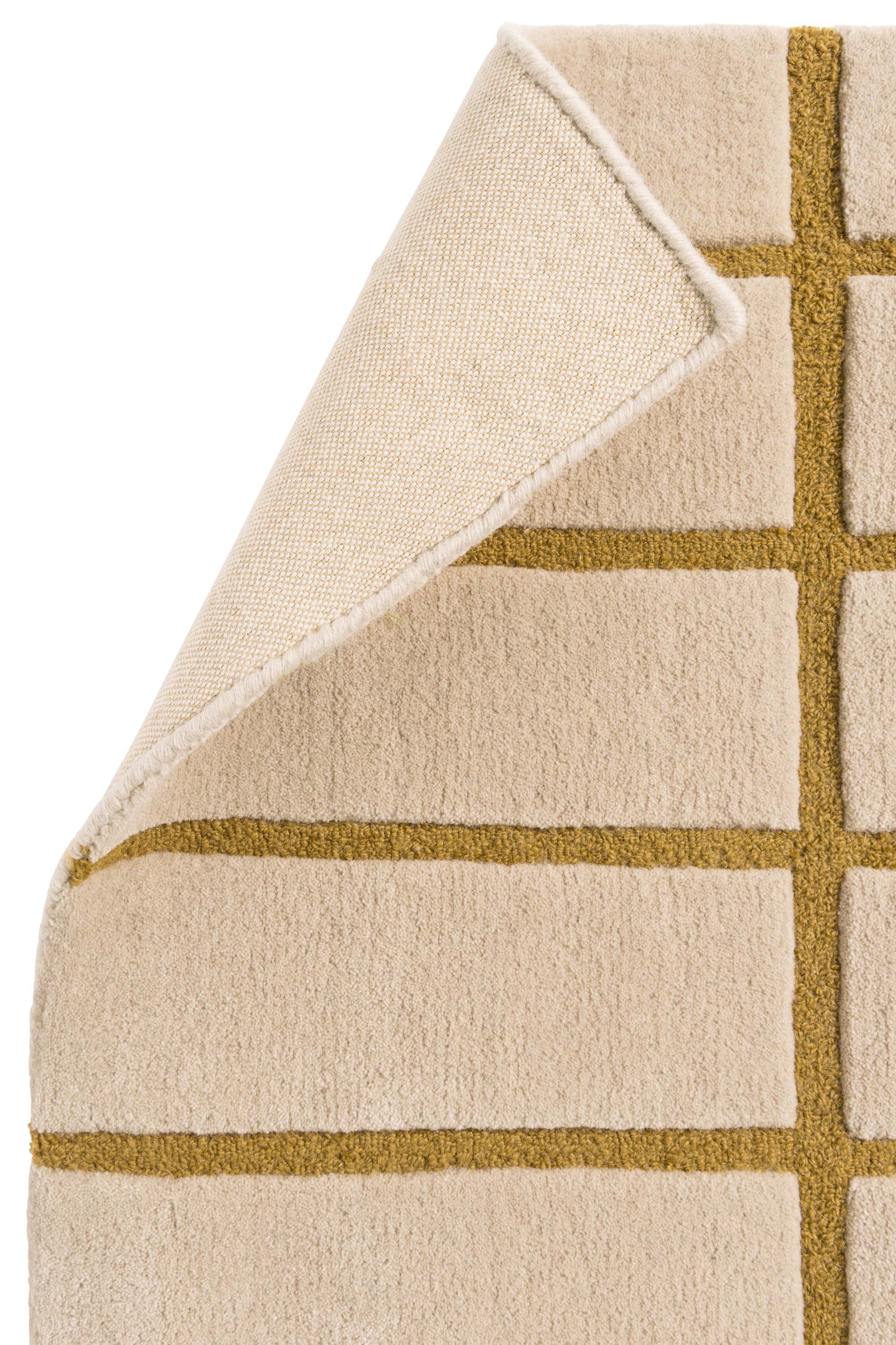 Geometric rug with blue grid pattern