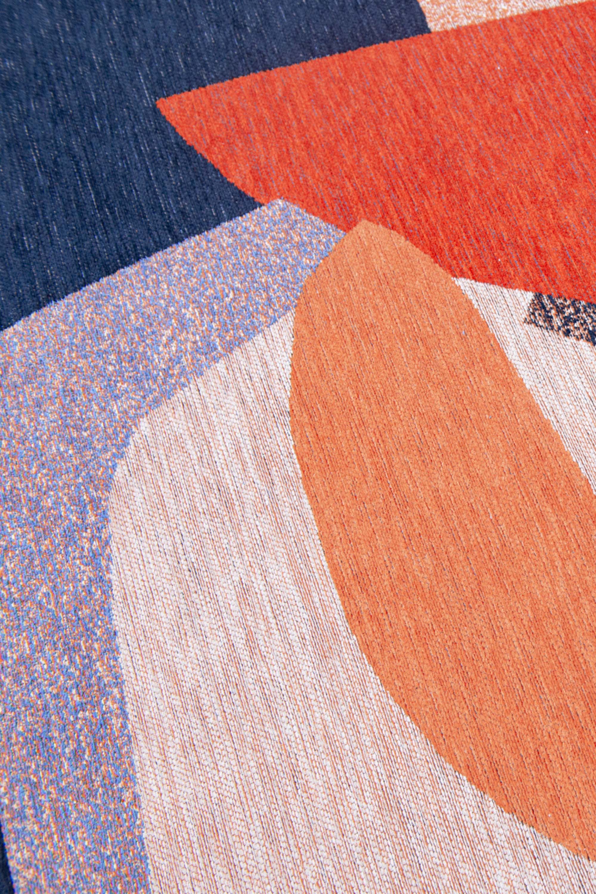 Modern rug with red and blue abstract pattern