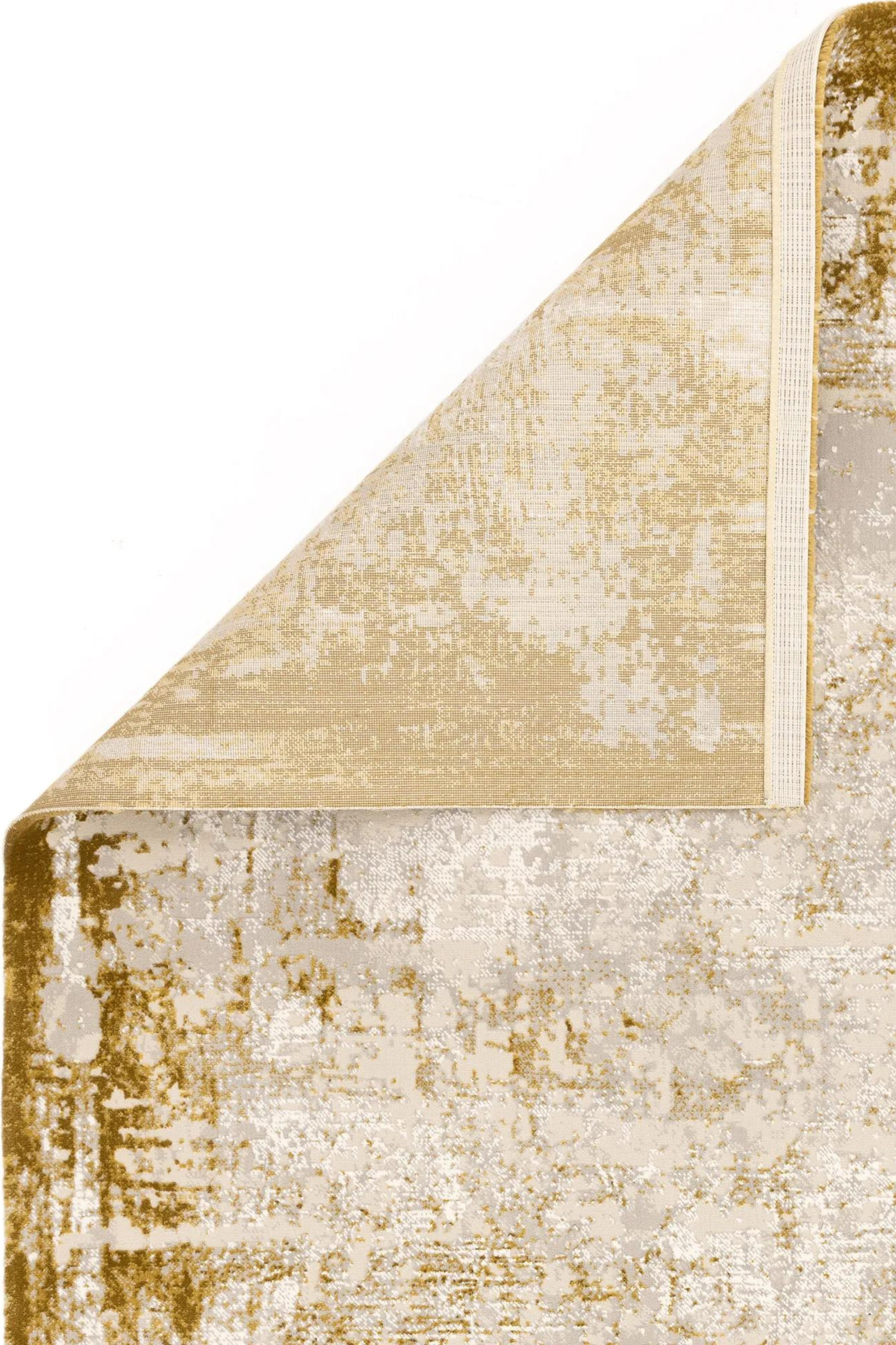 Modern flatweave rug with abstract gold design