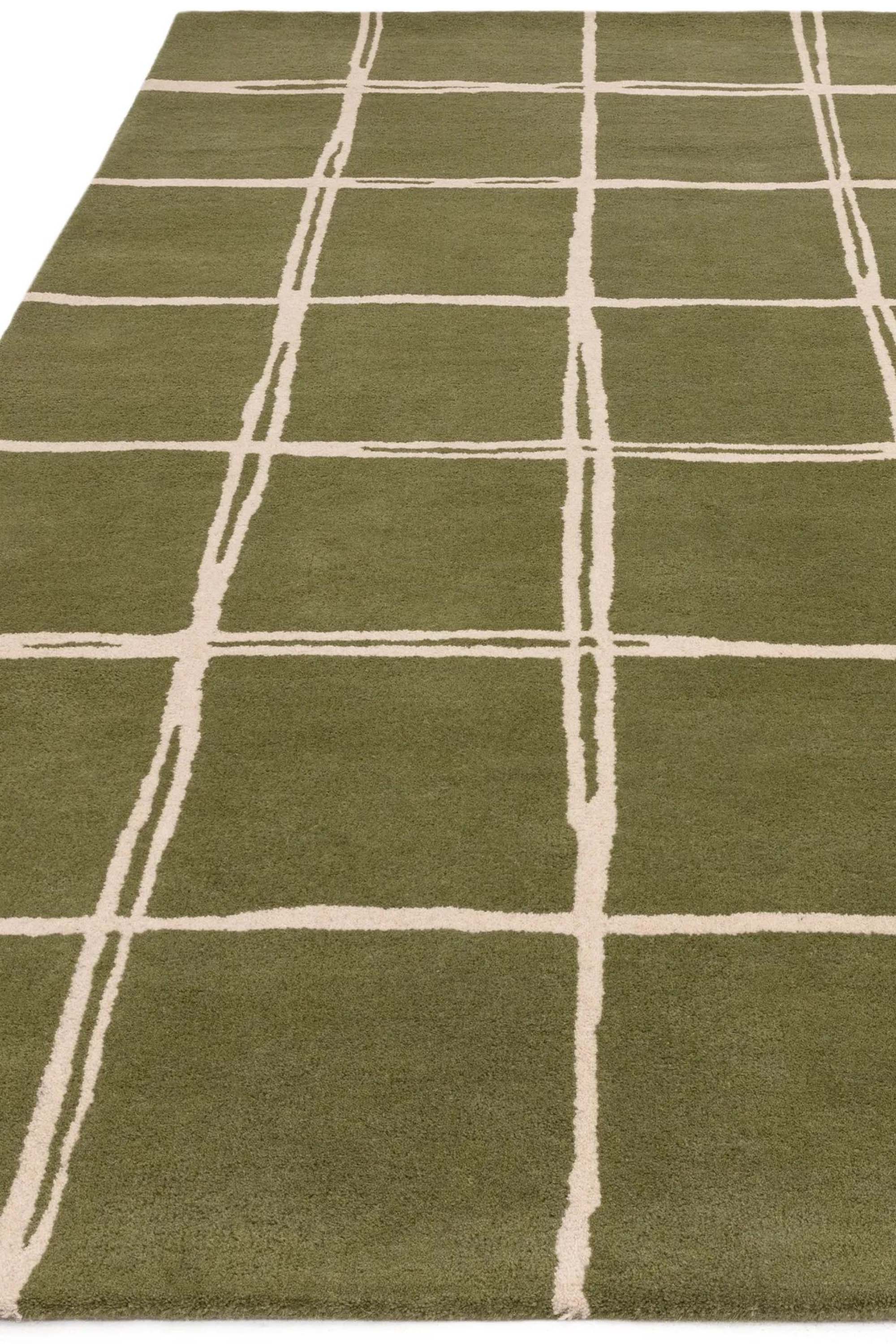 Green rug with minimal geometric pattern