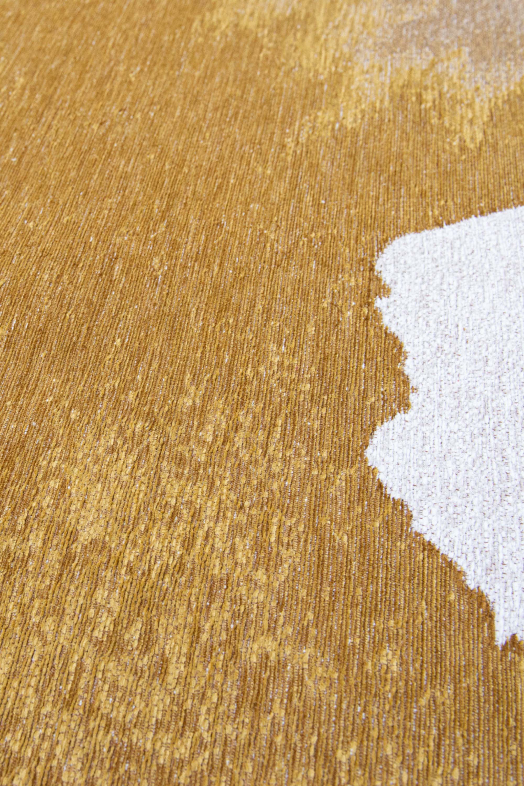 Modern rug with gold abstract shoreline pattern