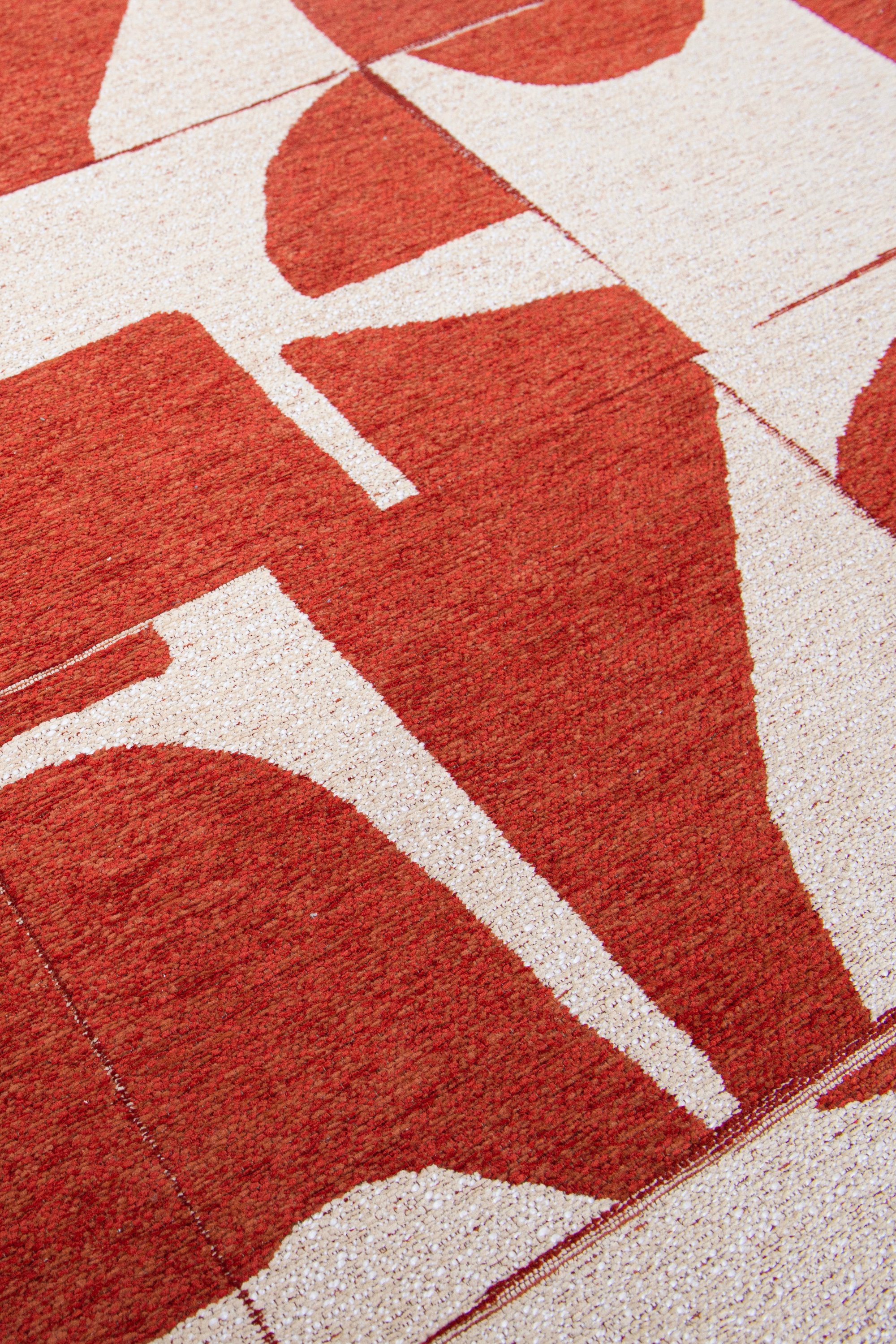 Modern abstract circle rug with red patchwork pattern