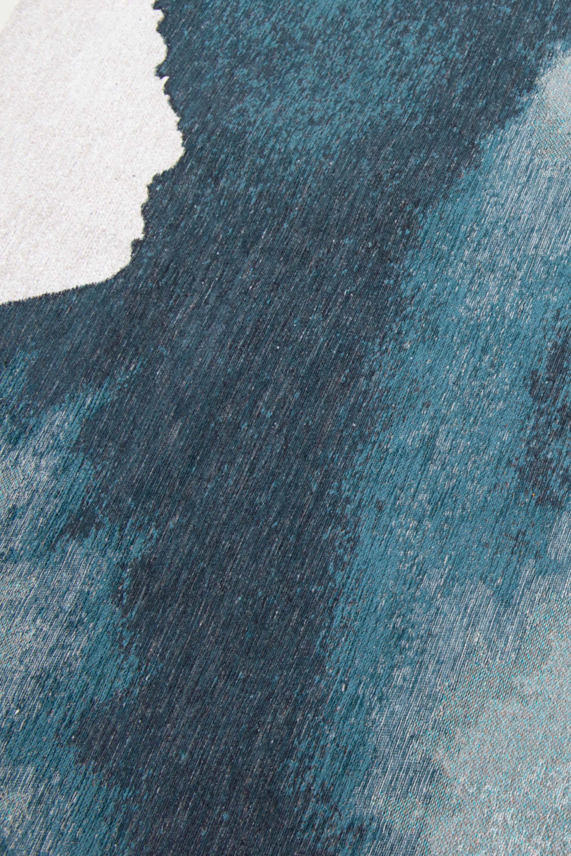 Modern circle rug with blue abstract shoreline pattern