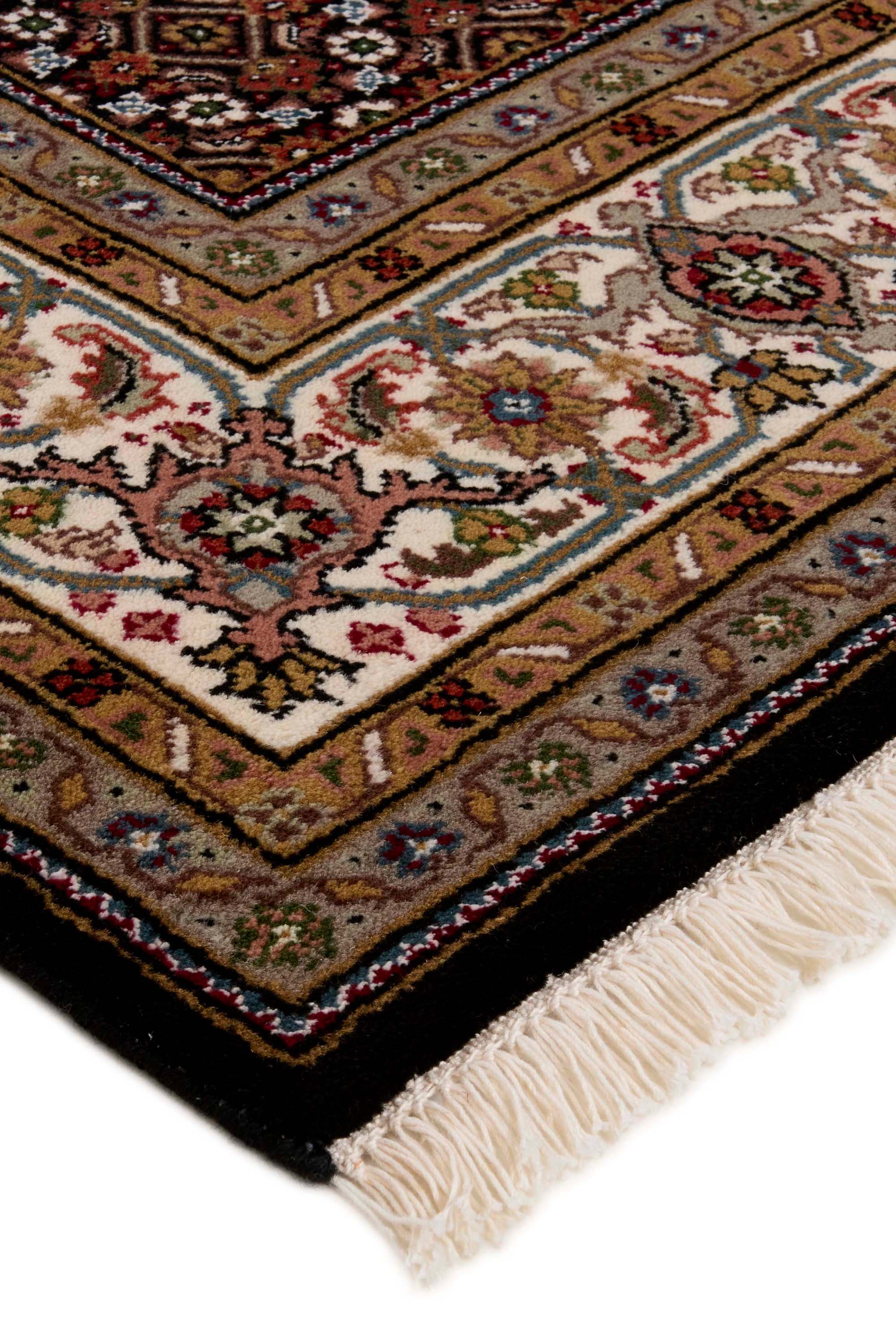 Bordered brown Persian Tabriz rug