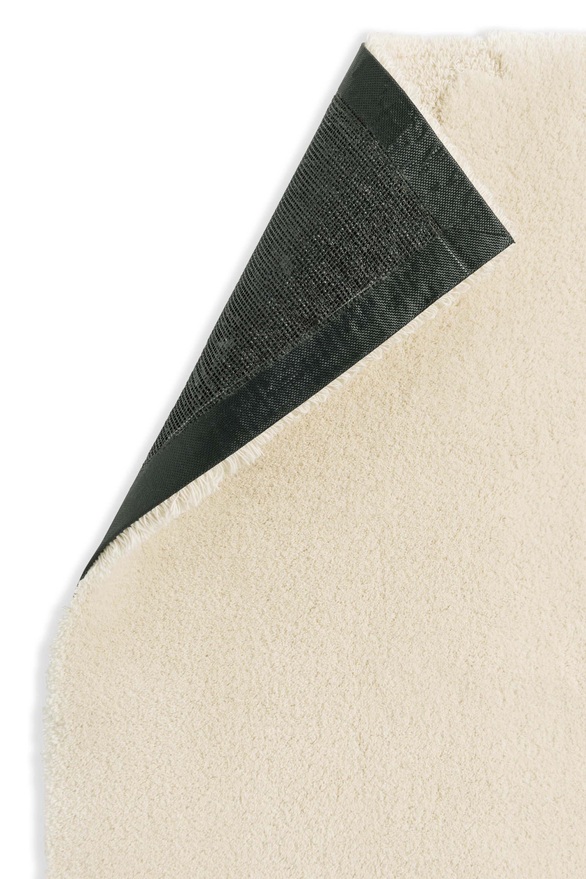 Plain rug with cream floral pattern