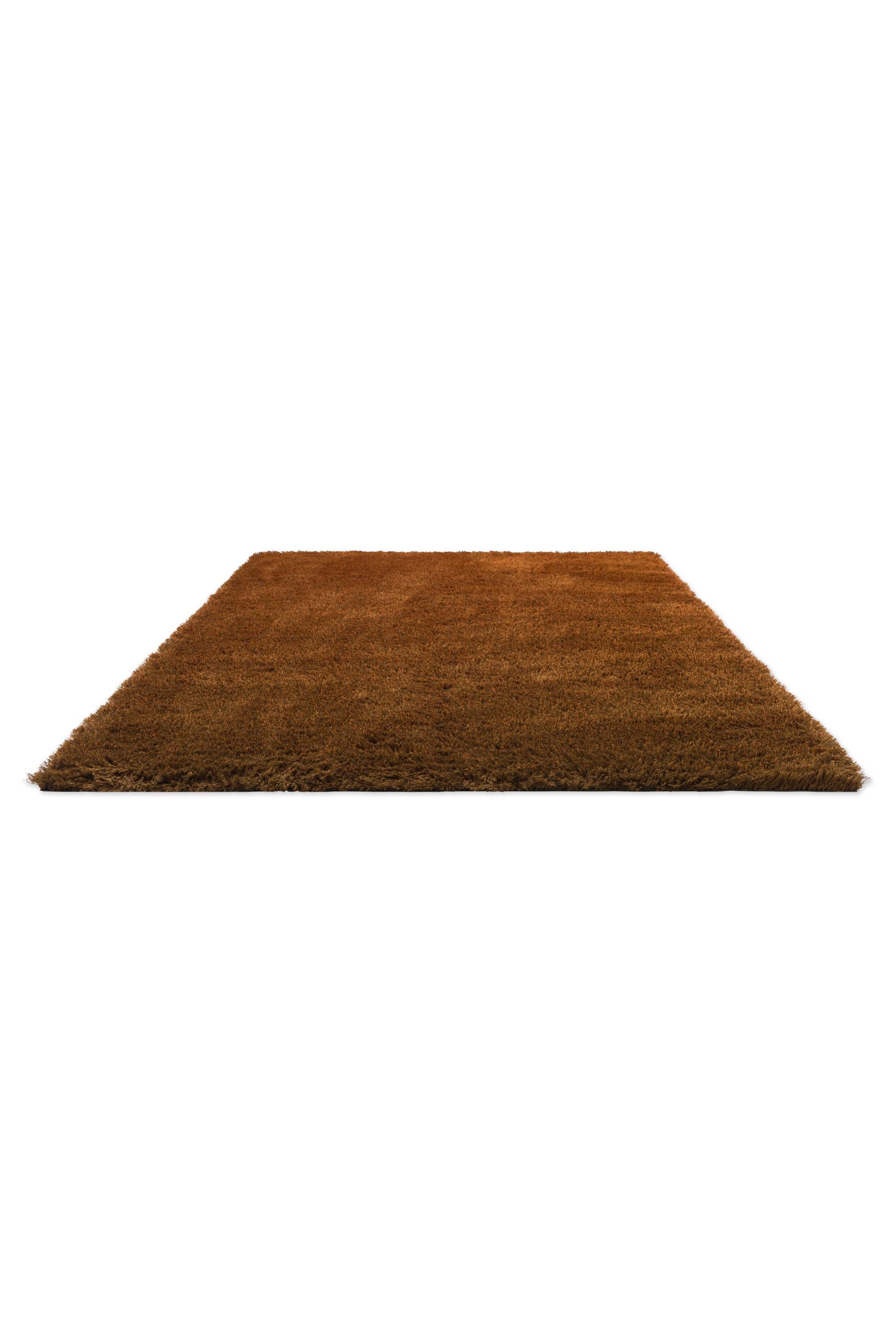 Plain orange rug with shaggy pile