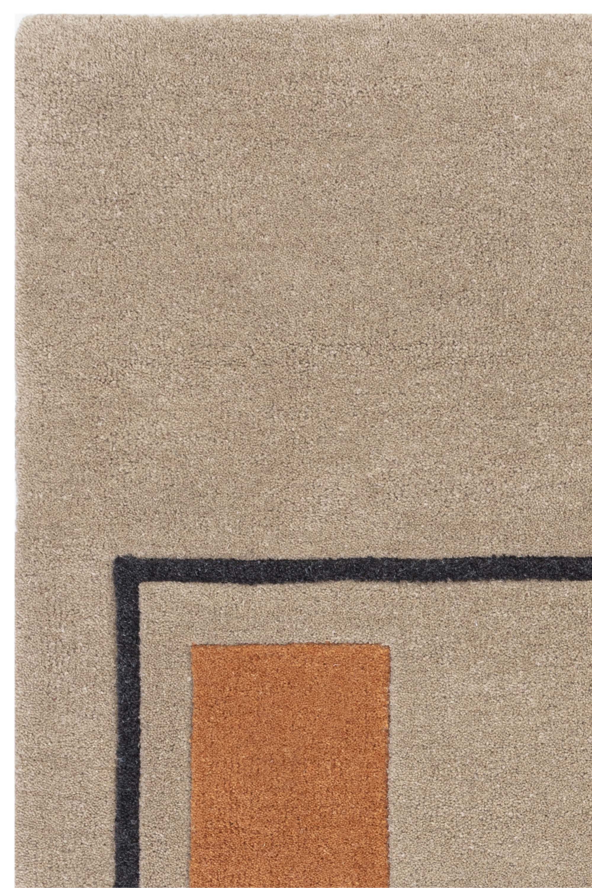 Geometric wool rug featuring a minimal pattern