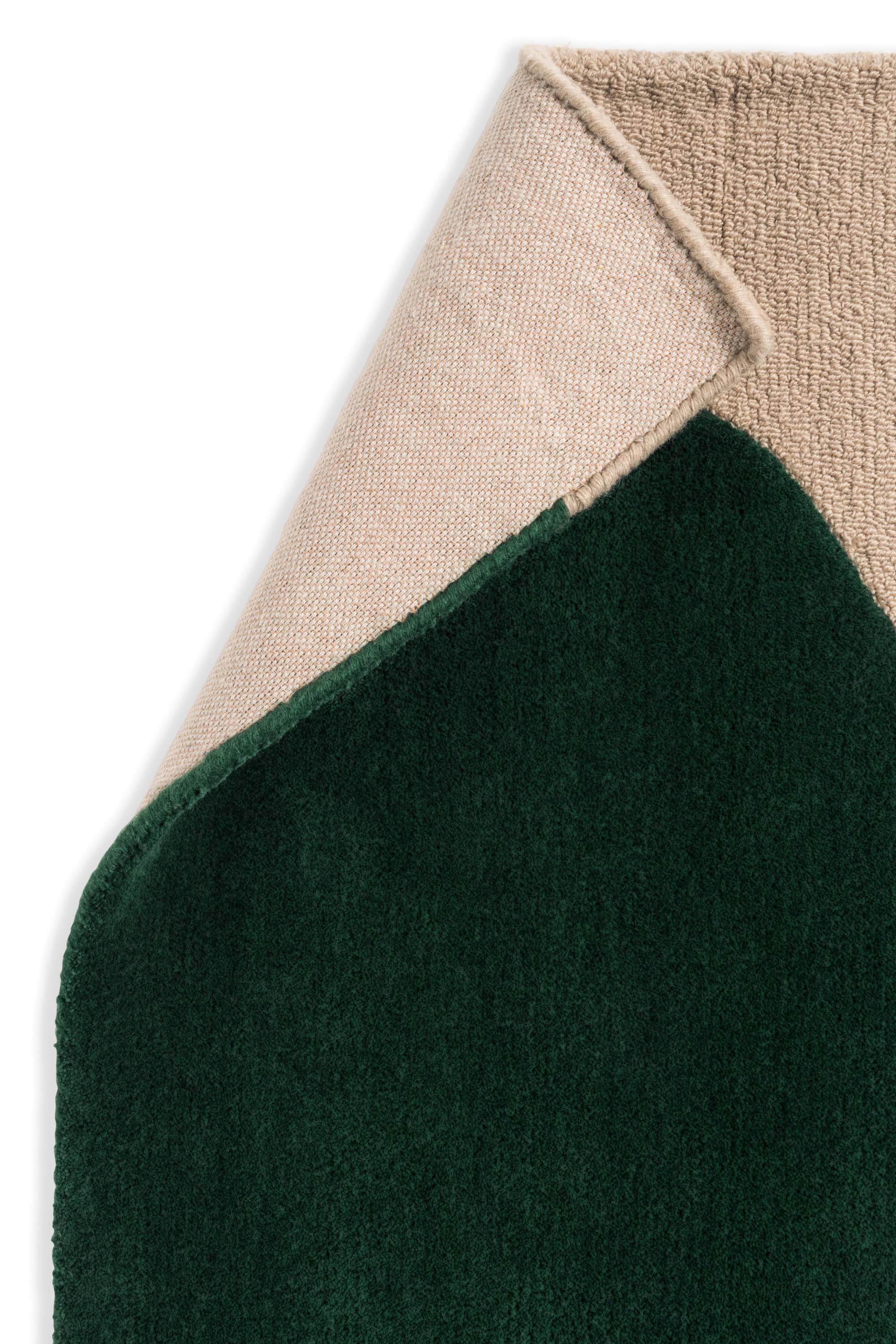 Beige rug with green repeated circle pattern