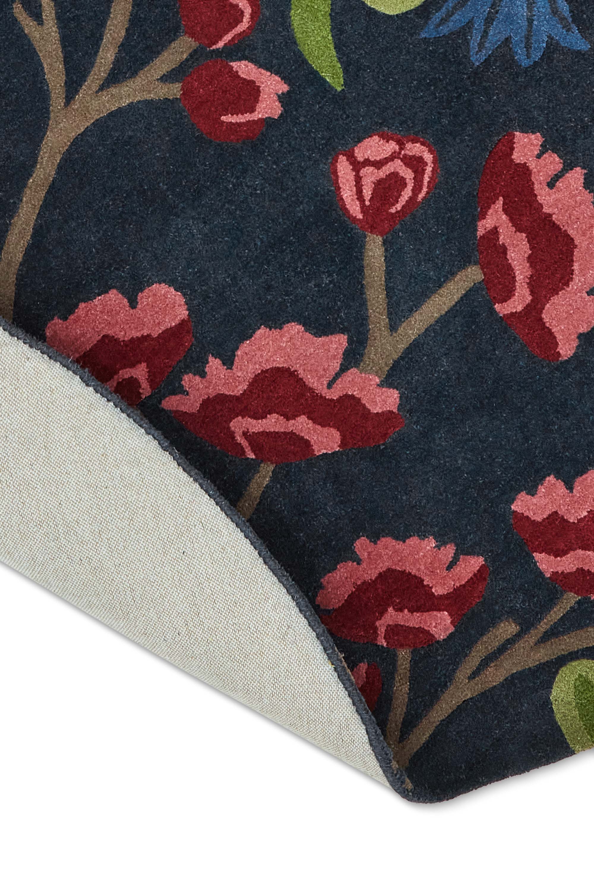 Modern circle rug with floral pattern in blue and natural tones