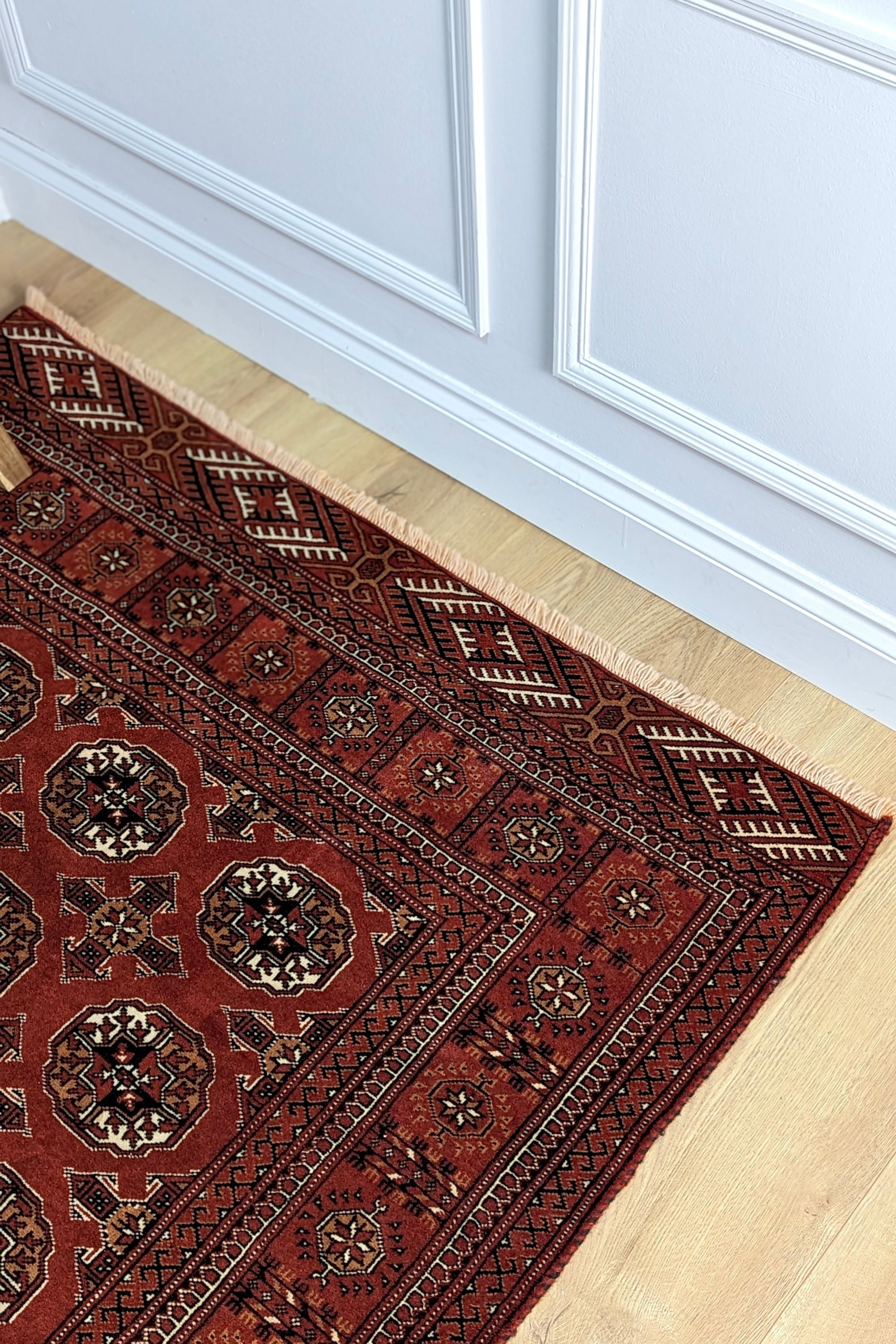 red oriental rug with traditional pattern