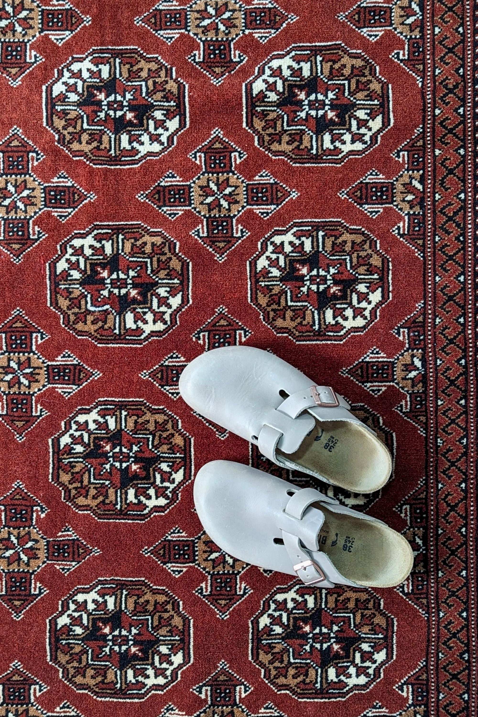 red oriental rug with traditional pattern