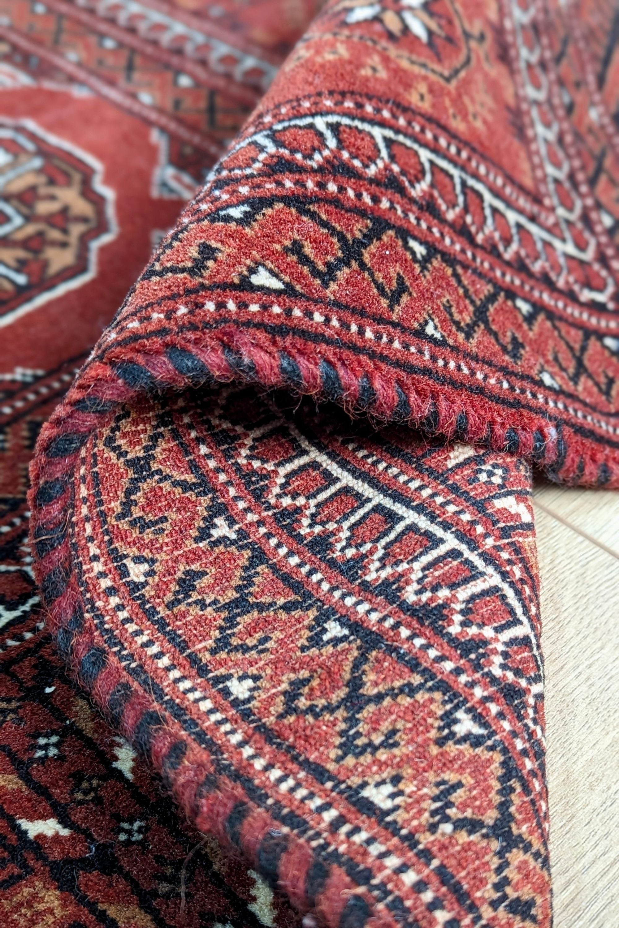 red oriental rug with traditional pattern