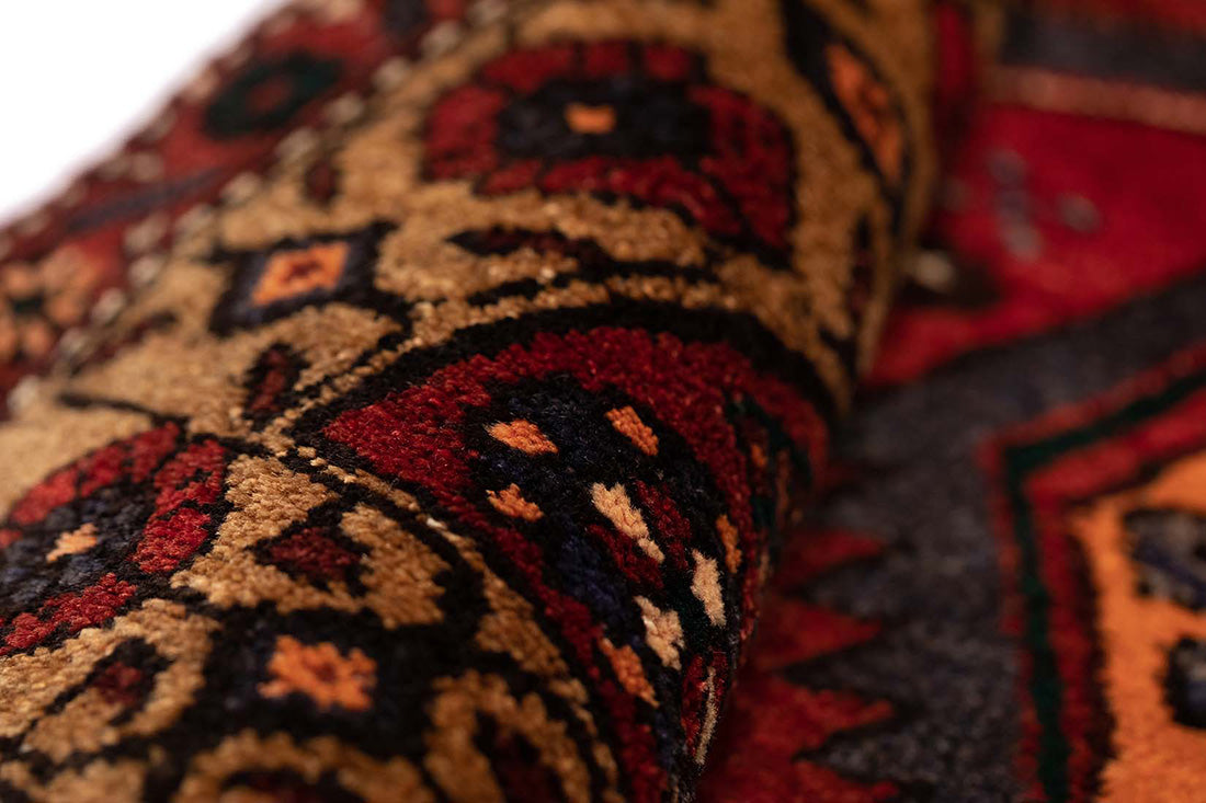 authentic persian runner with stylised geometric design in red
