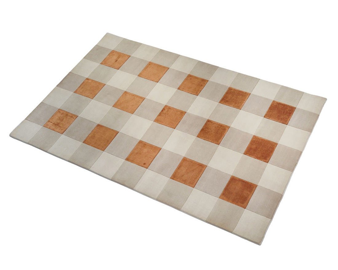 cream and copper rug with geometric pattern