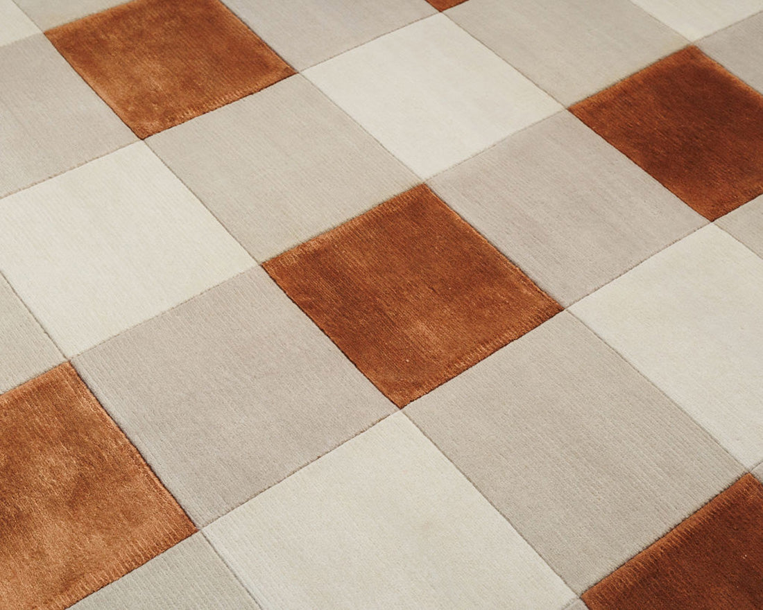 cream and copper rug with geometric pattern