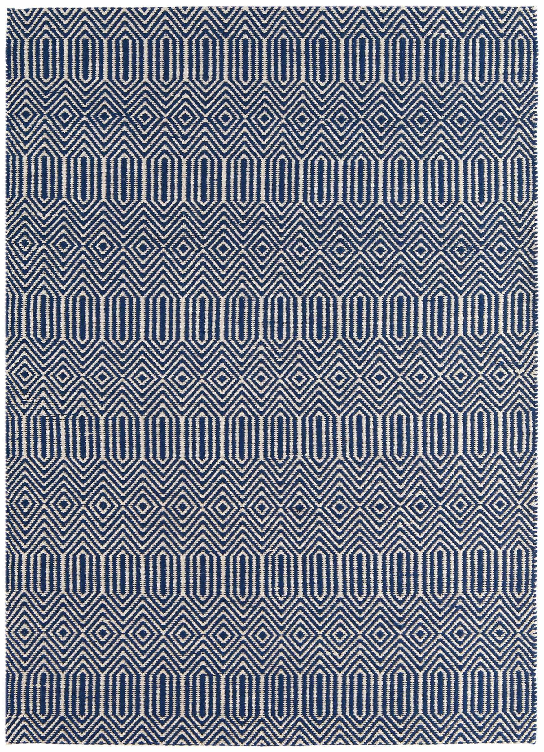blue and white woven rug with aztec chevron pattern