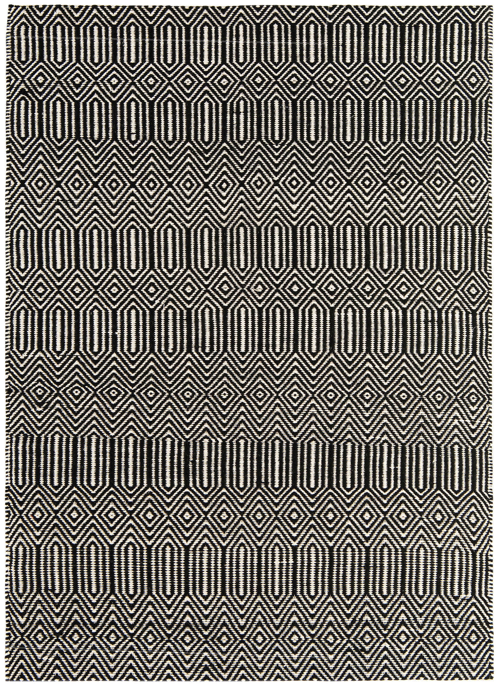 black and white woven rug with aztec chevron pattern