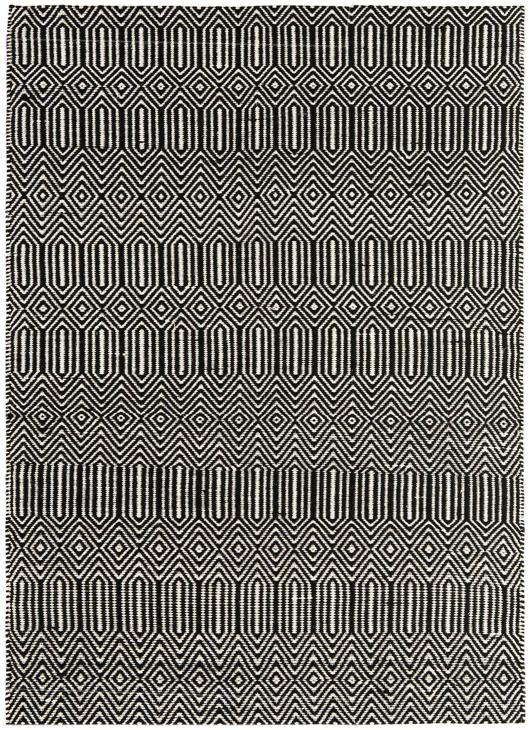 black and white woven rug with aztec chevron pattern