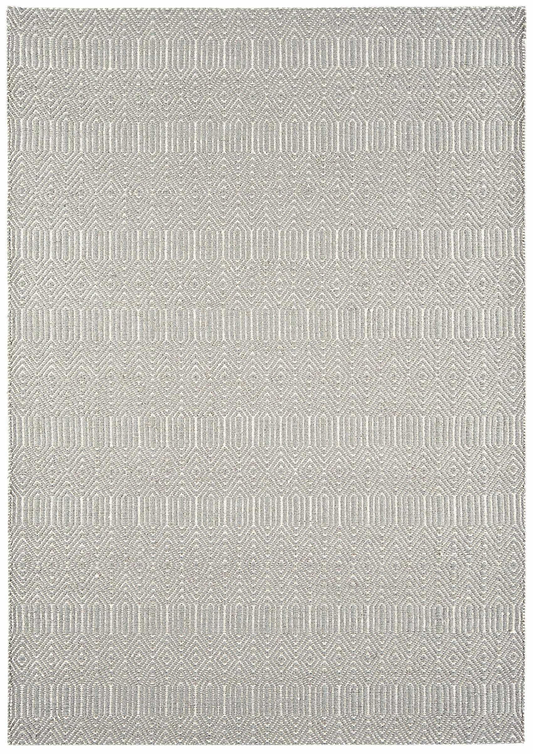 silver and white rug with aztec chevron pattern
