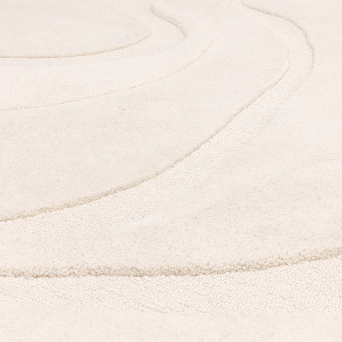 Modern rectangle cream rug with fluid abstract pattern