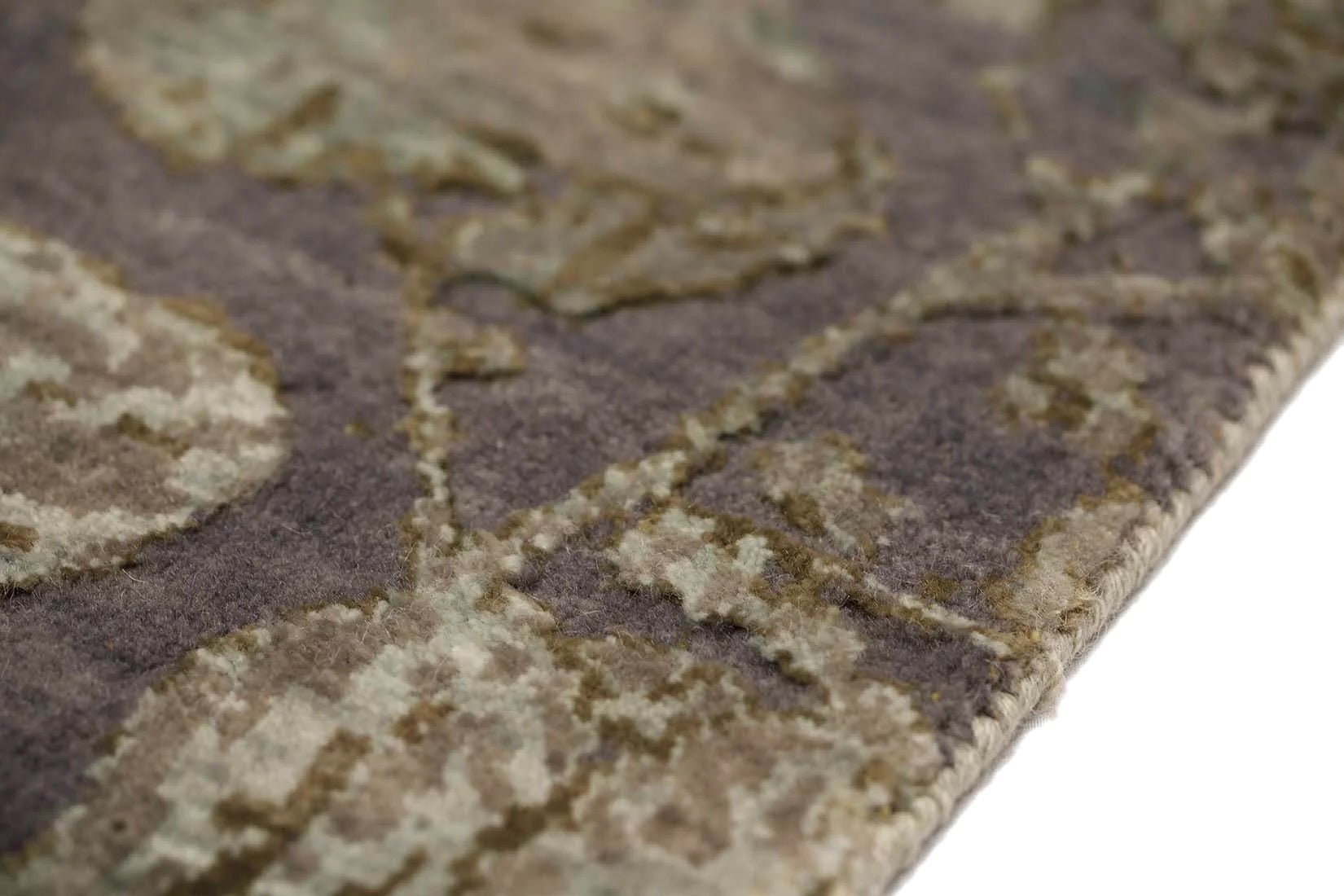 grey and taupe rug with an abstract damask pattern