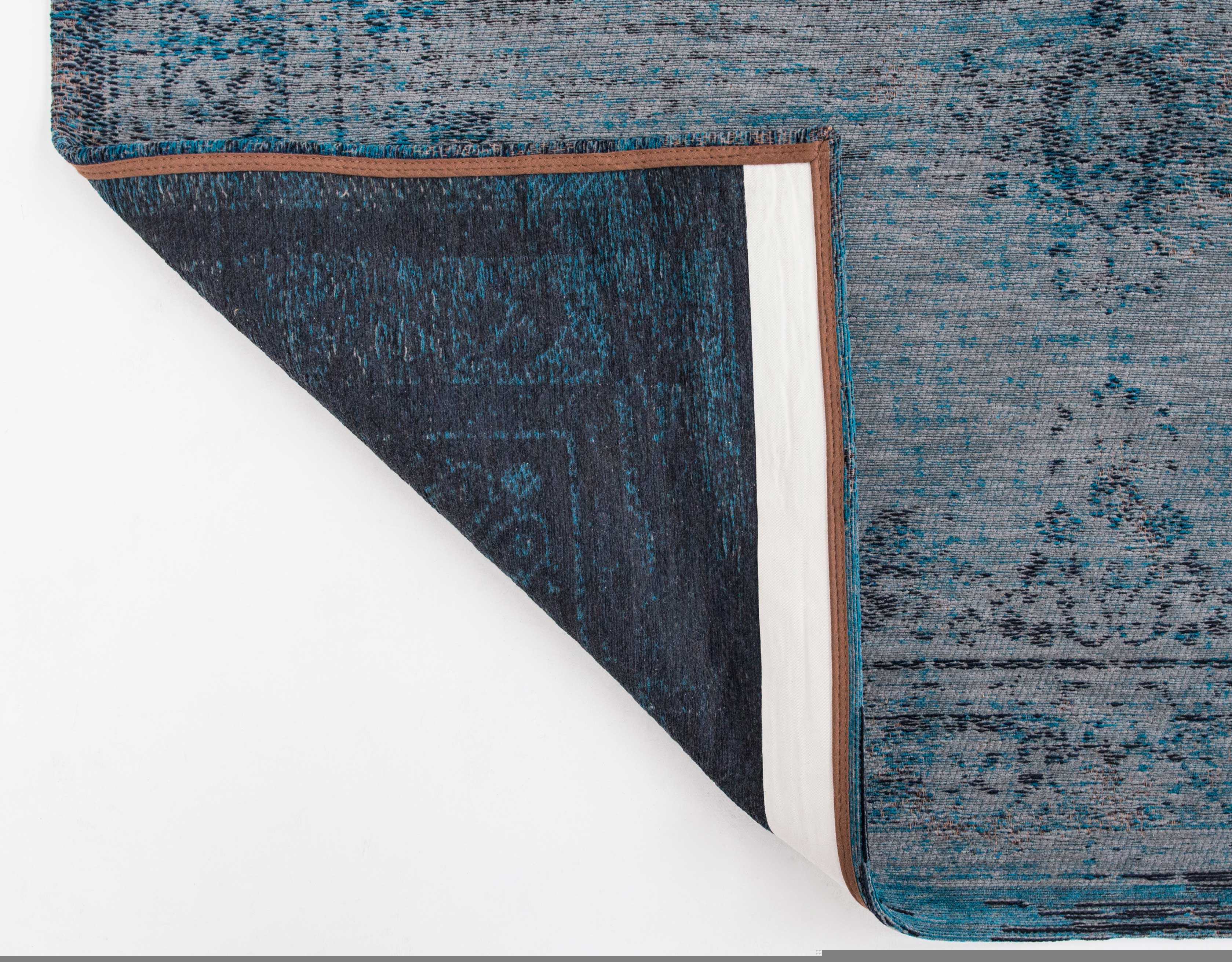 Grey and blue flatweave rug with faded persian design