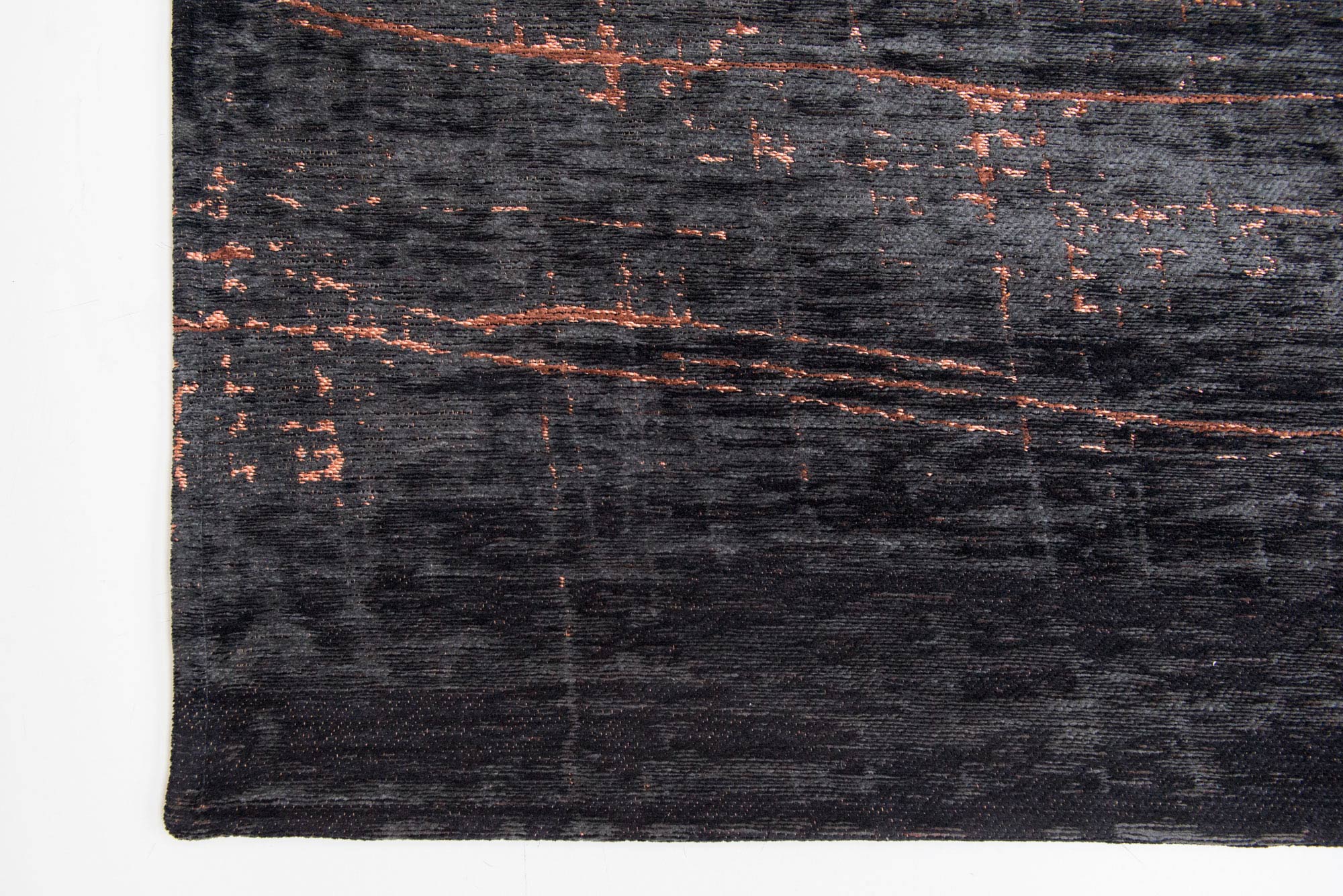 Black flatweave rug with copper brown abstract pattern