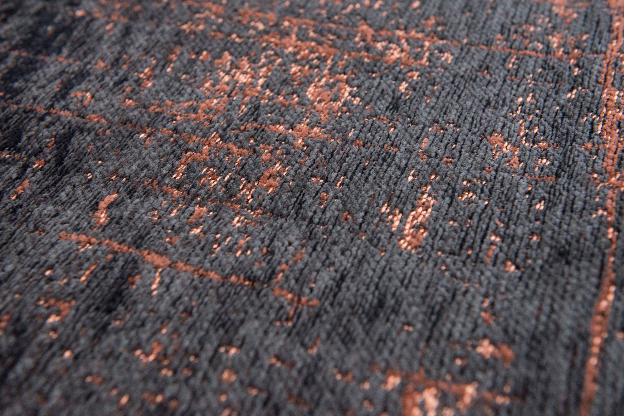 Black flatweave rug with copper brown abstract pattern