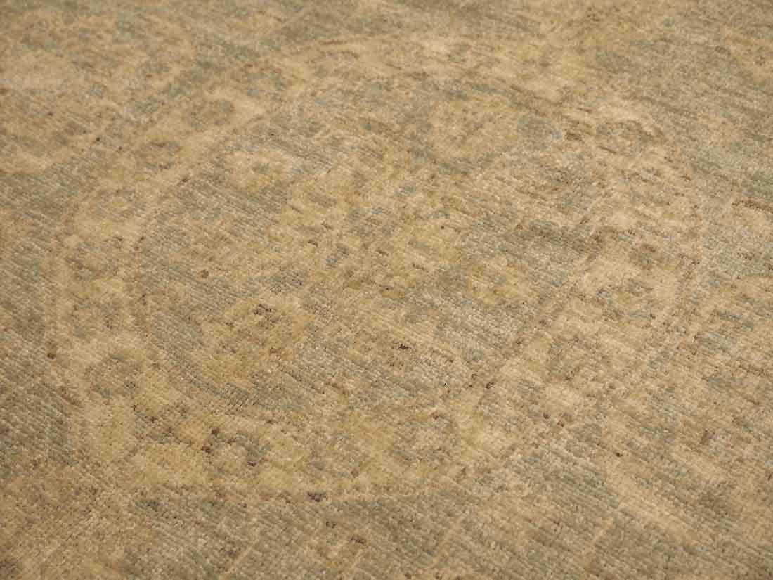 Authentic persian rug with delicate floral pattern in beige