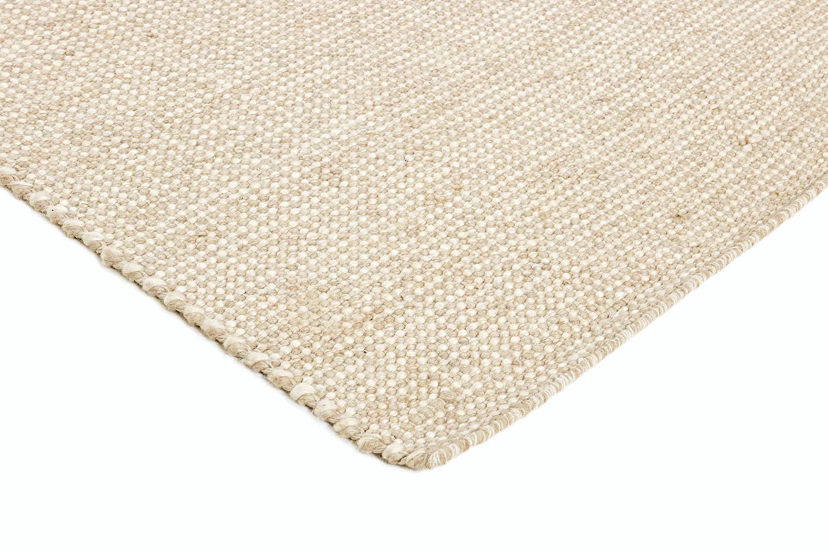 Simple beige textured area rug