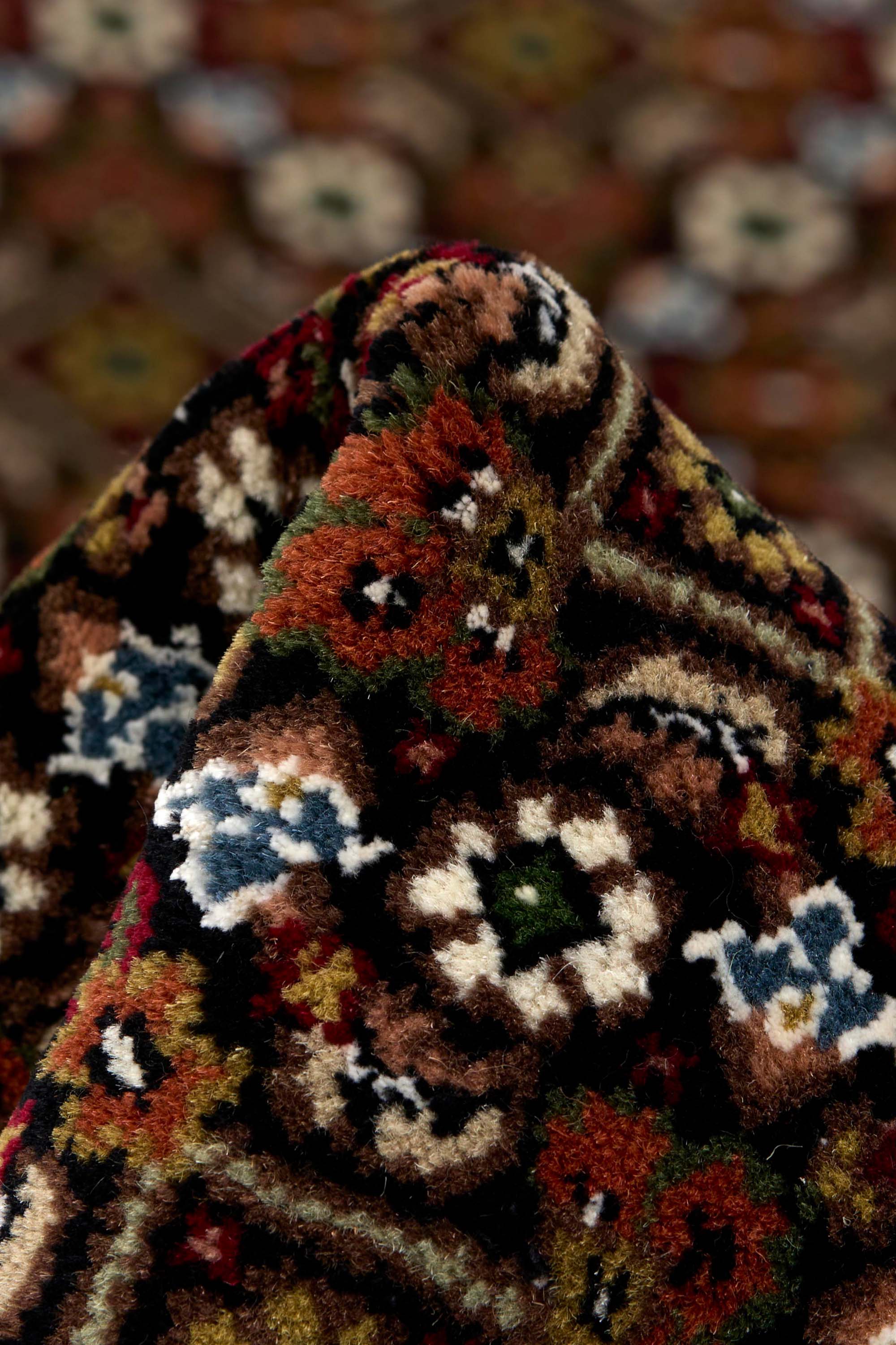 Bordered brown Persian Tabriz rug