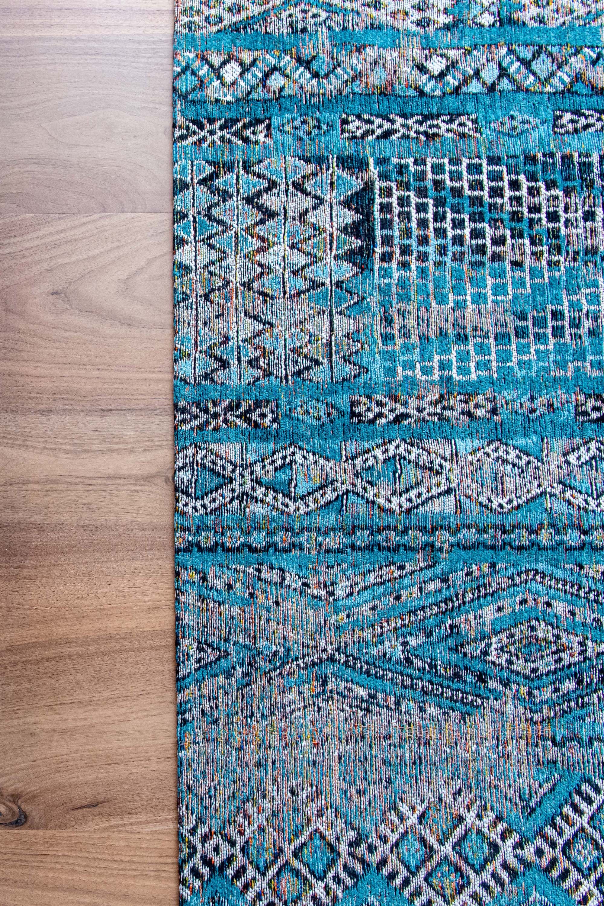 blue rug with a moroccan geometric pattern