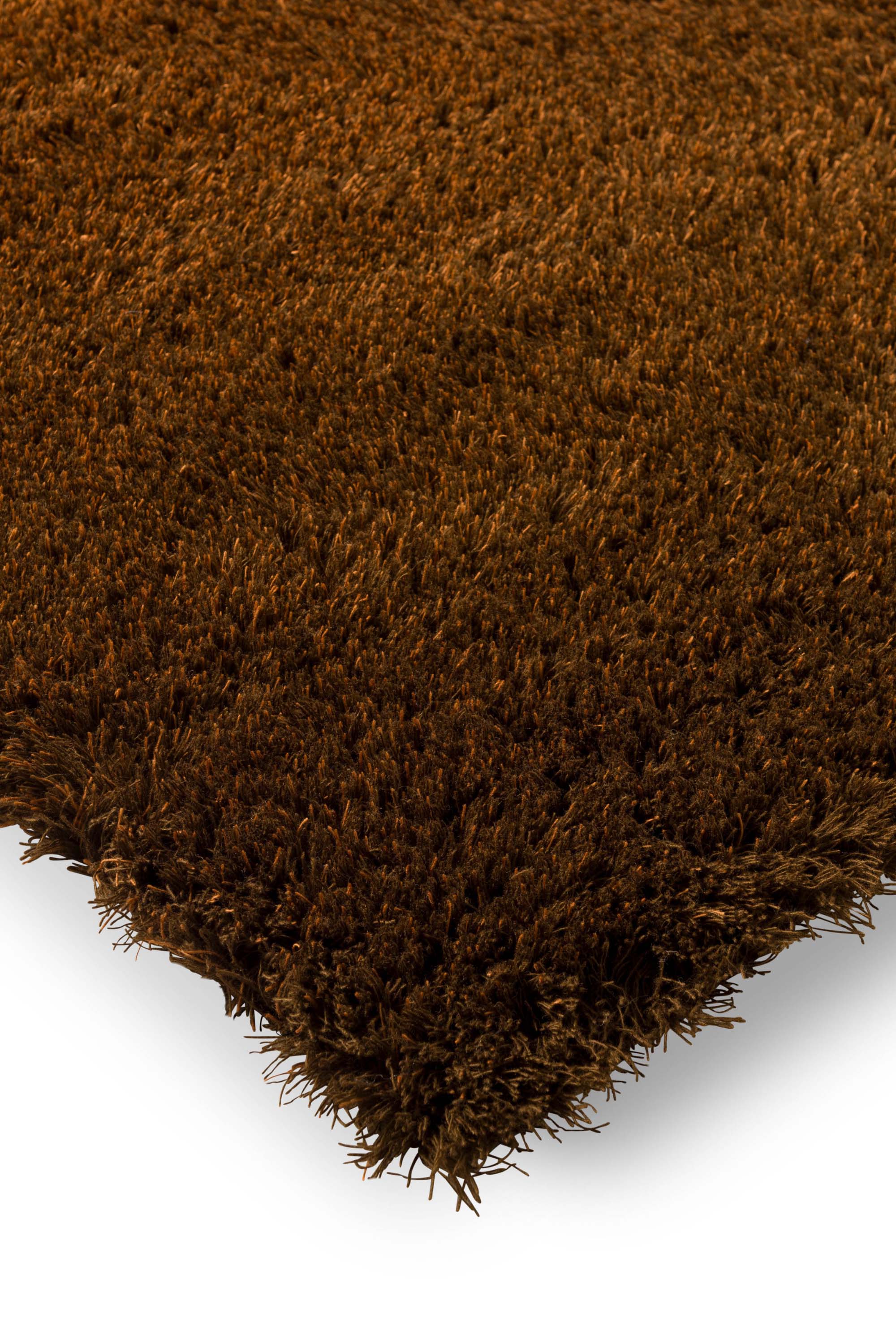 Plain orange rug with shaggy pile