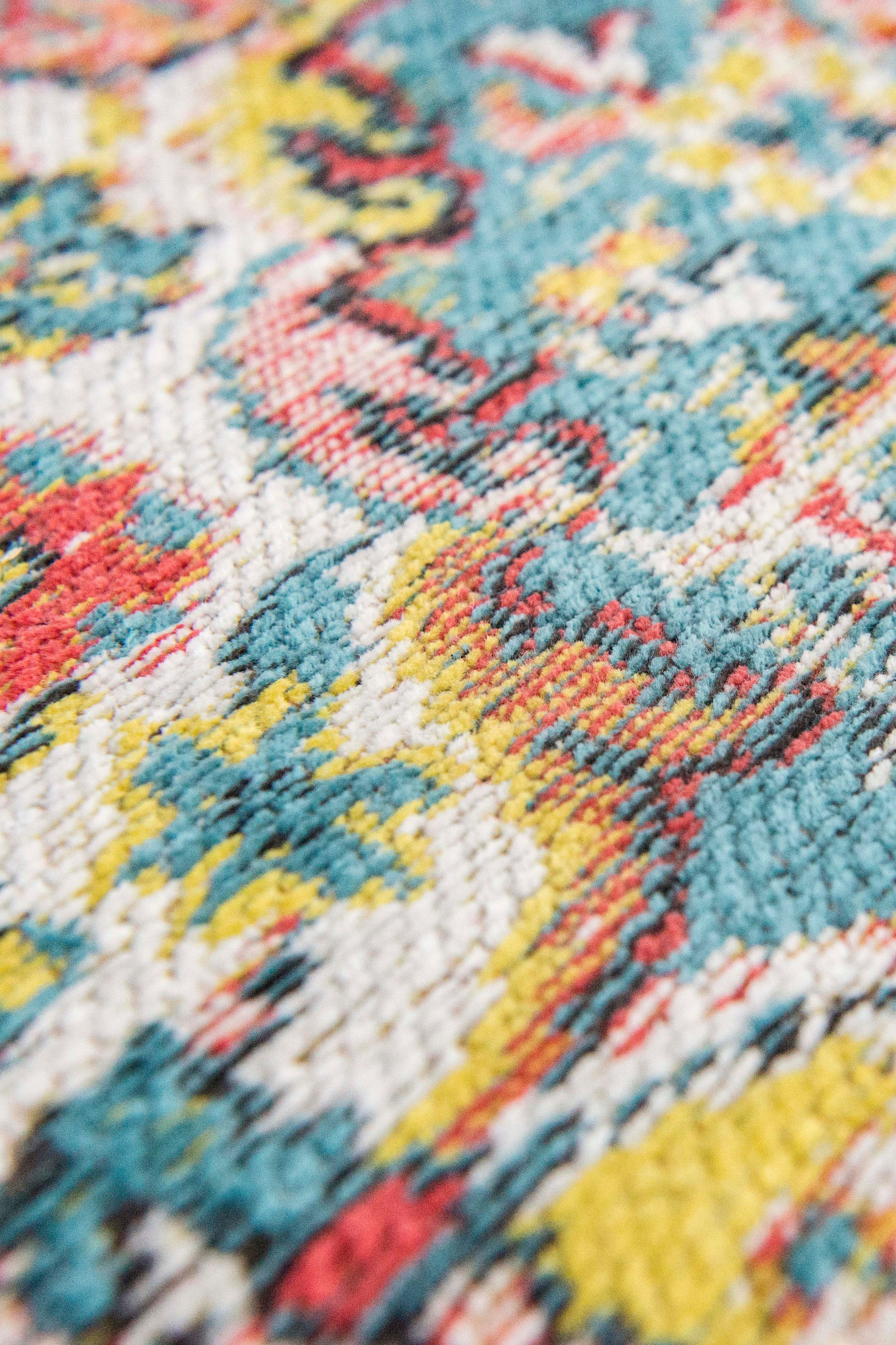 Flatweave rug with faded persian design in blue, red and yellow