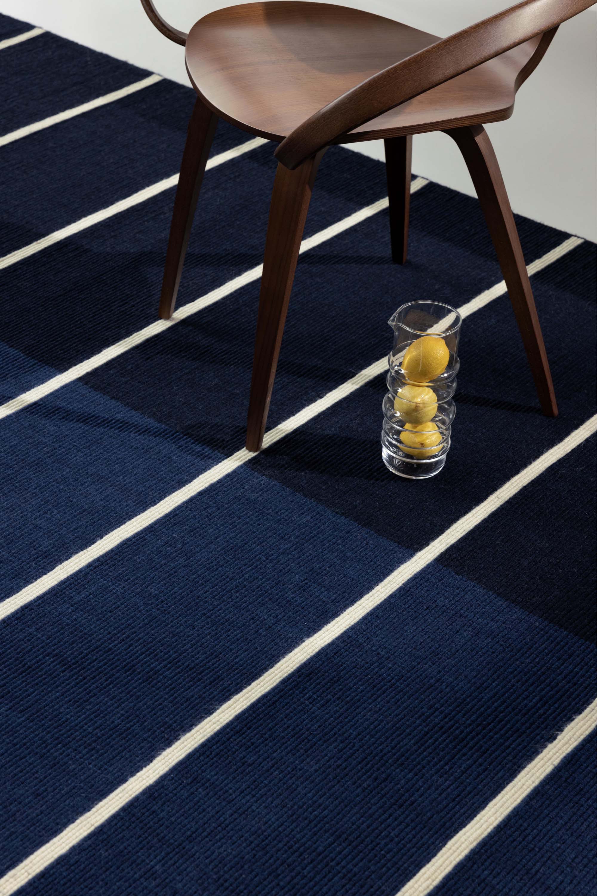Geometric rug with blue linear pattern