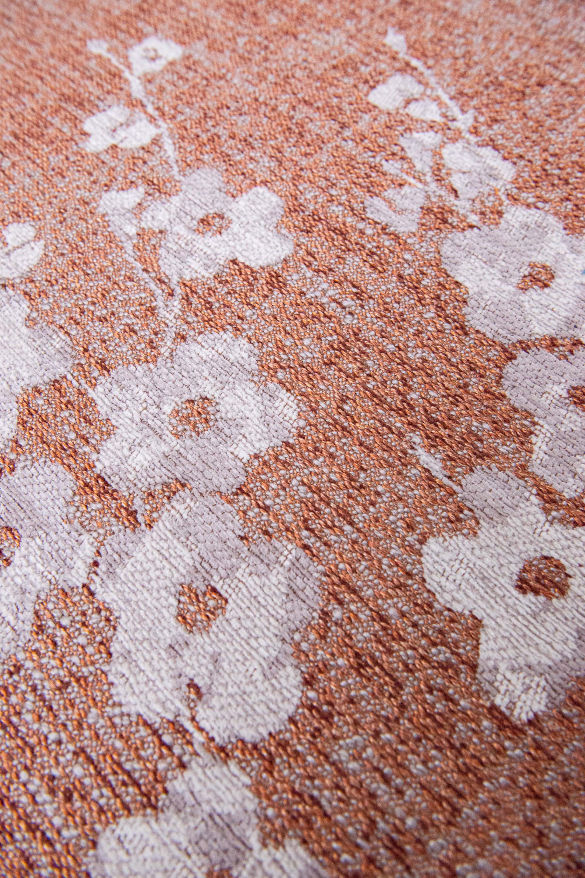 Modern abstract circle rug with subtle pink floral pattern