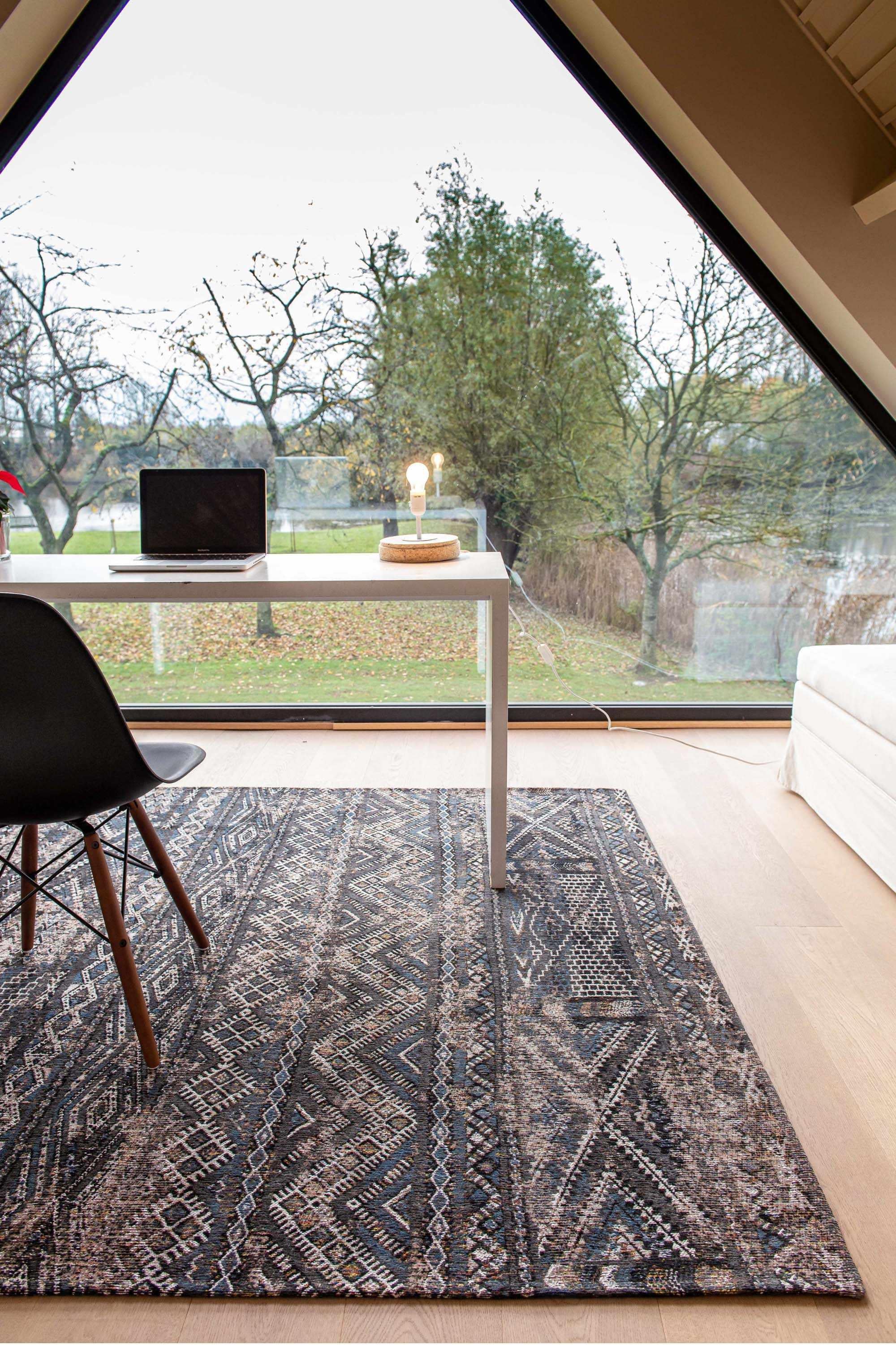 brown rug with a moroccan geometric pattern