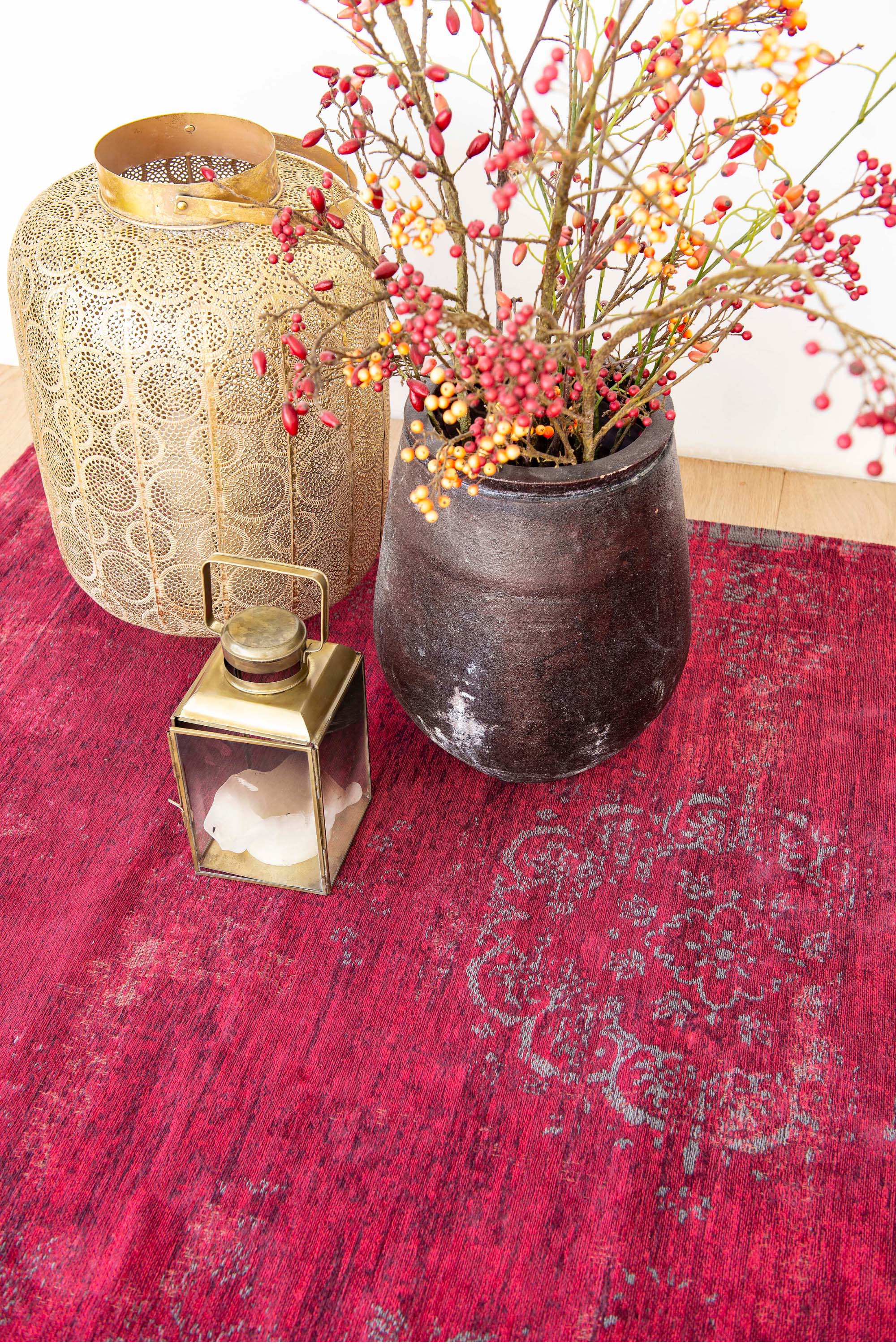 Red rug with faded persian design