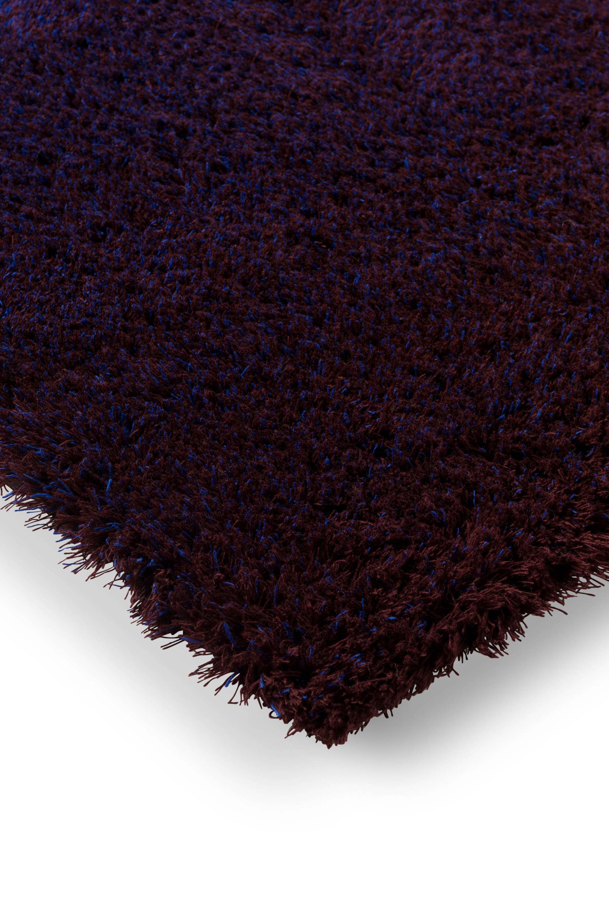Plain blue rug with shaggy pile