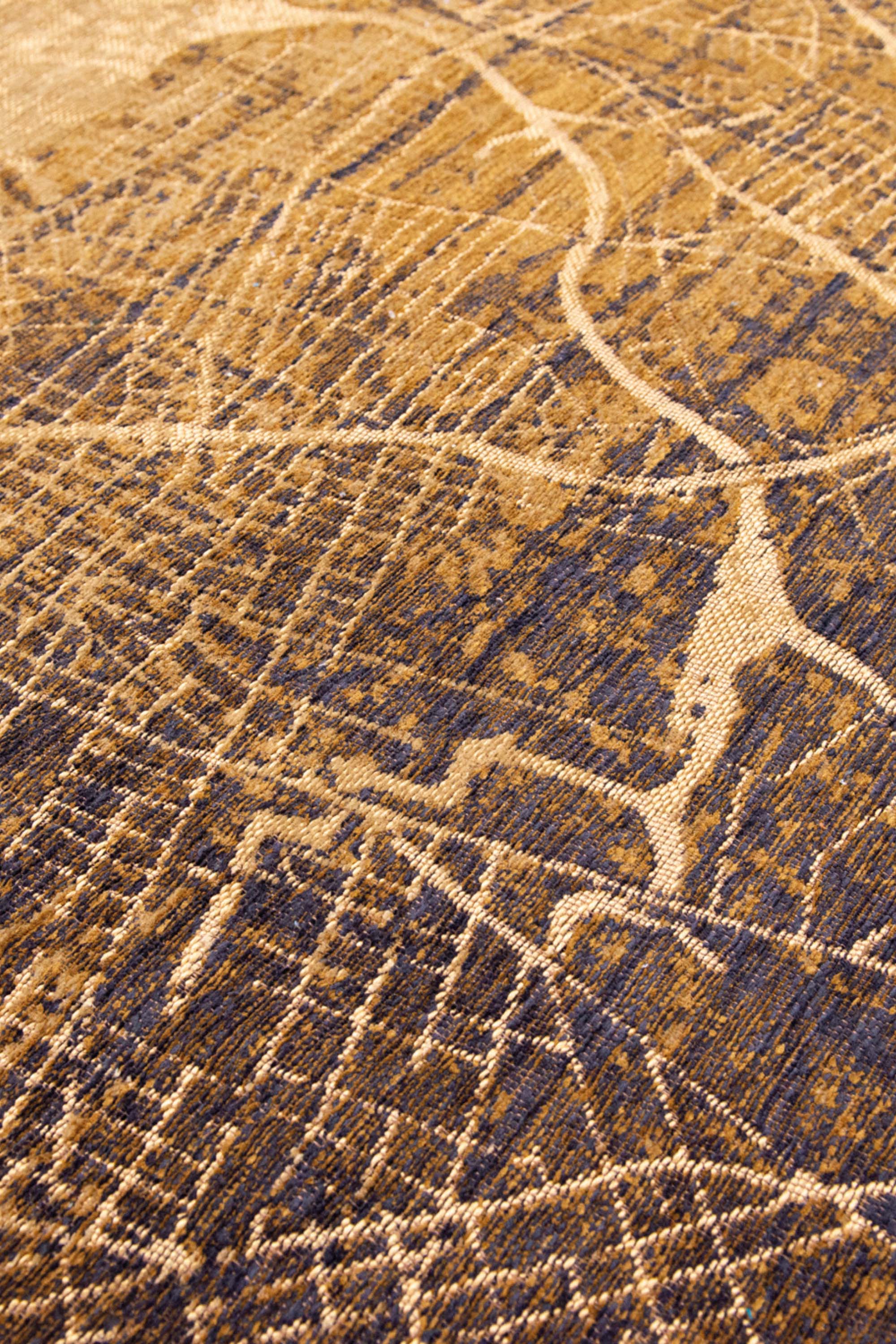 Gold abstract rug with a pattern inspired by the map of New York