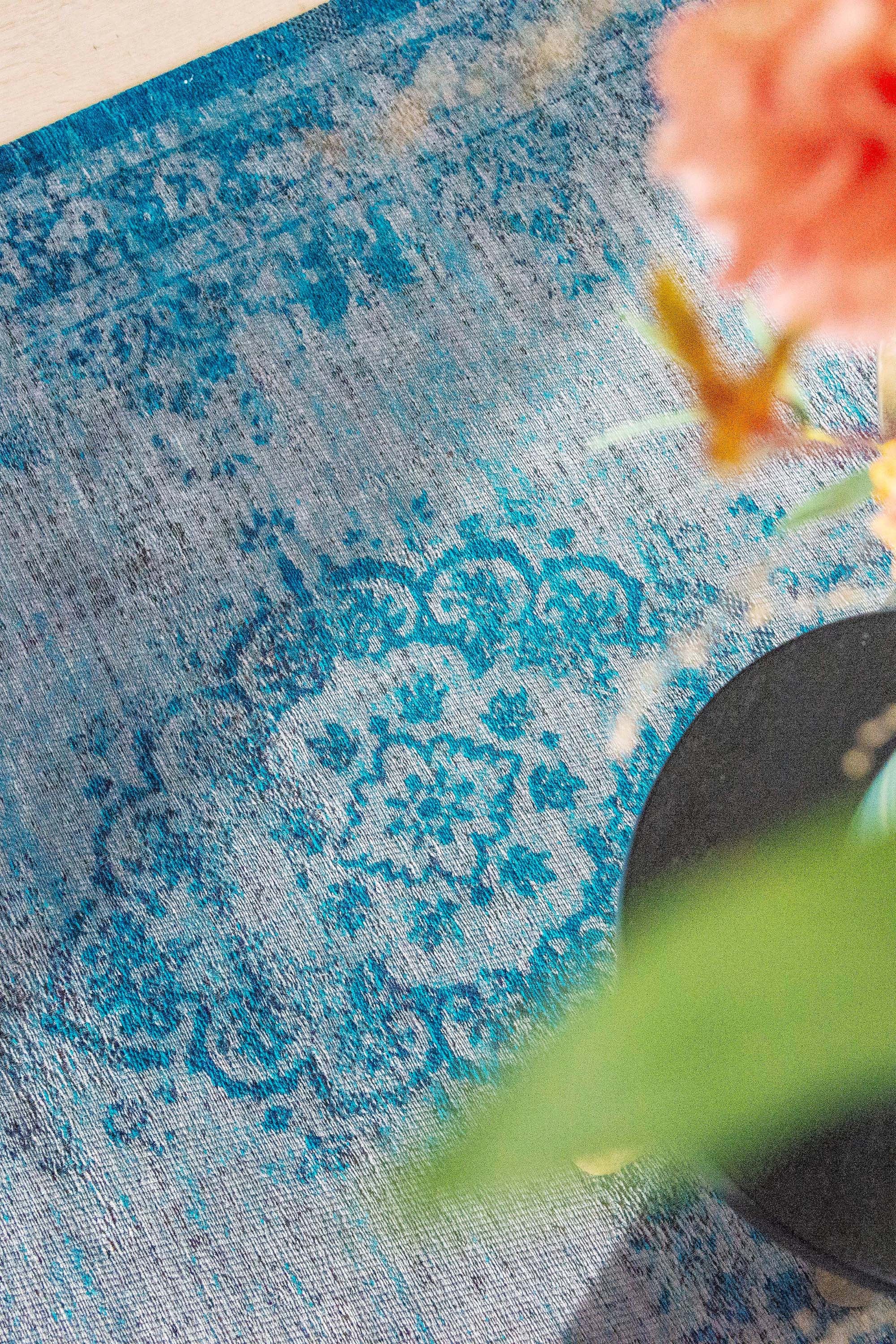 Grey and blue flatweave rug with faded persian design