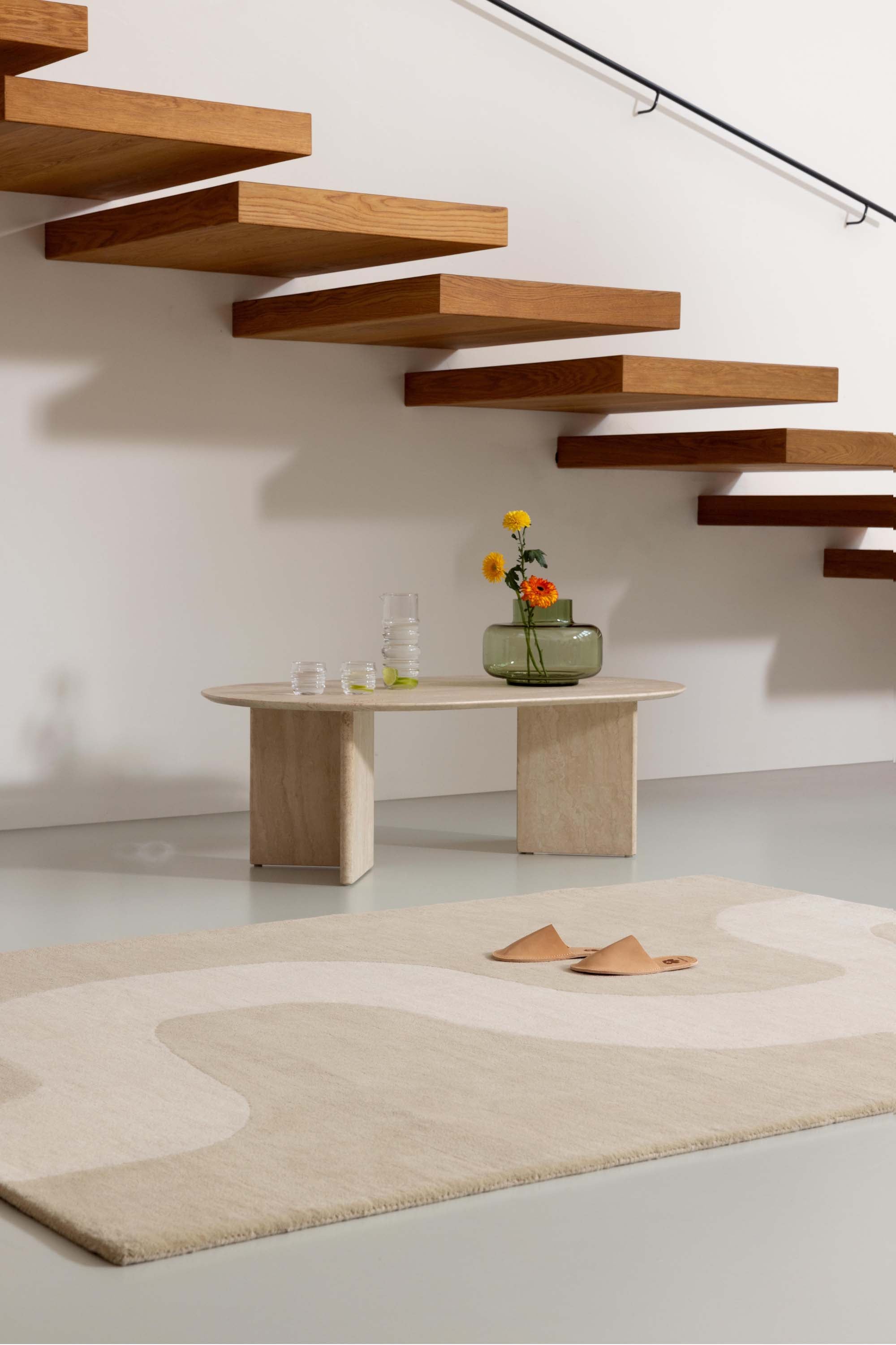 Beige rug with cream winding pattern