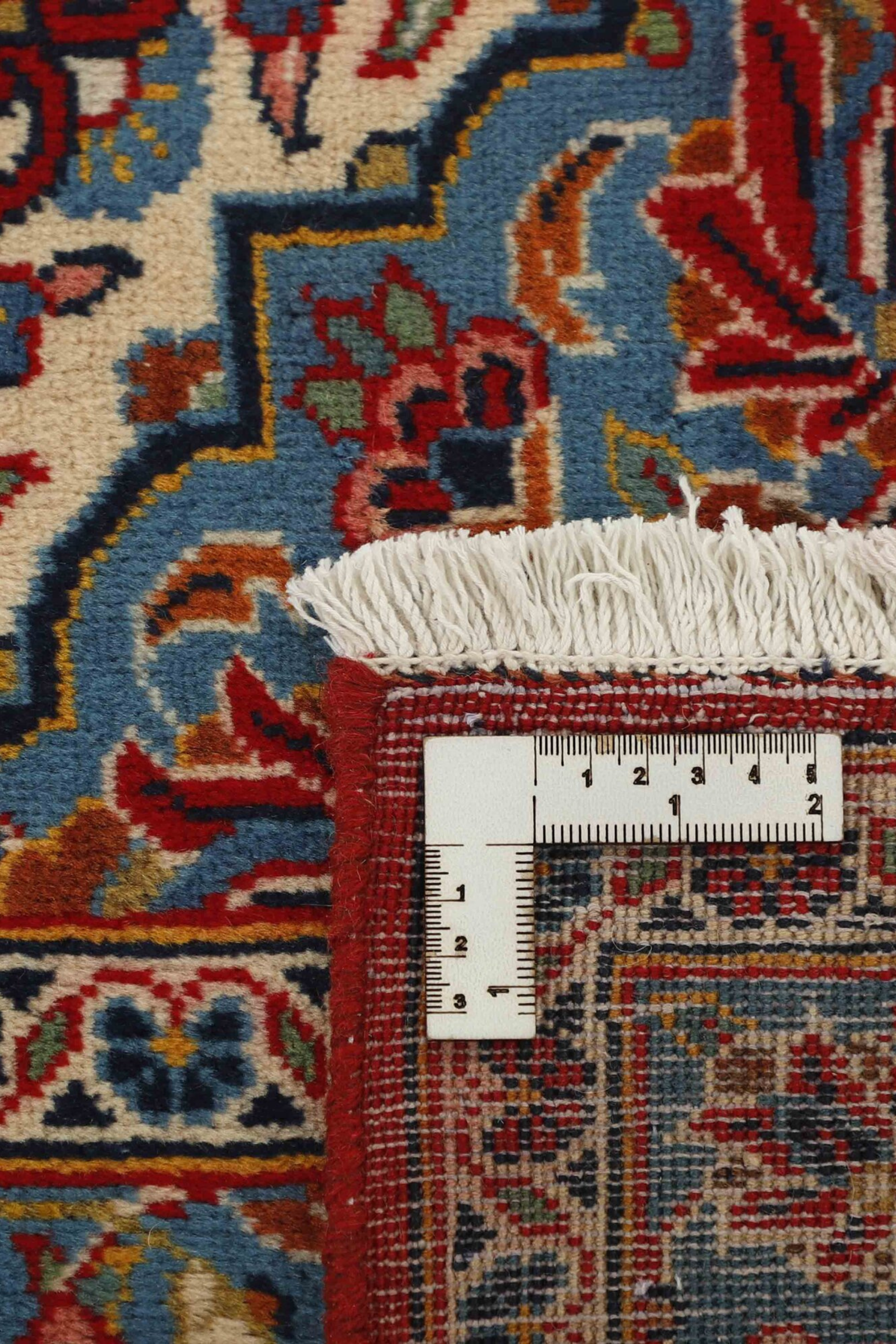 Authentic persian rug with traditional floral design in red and blue